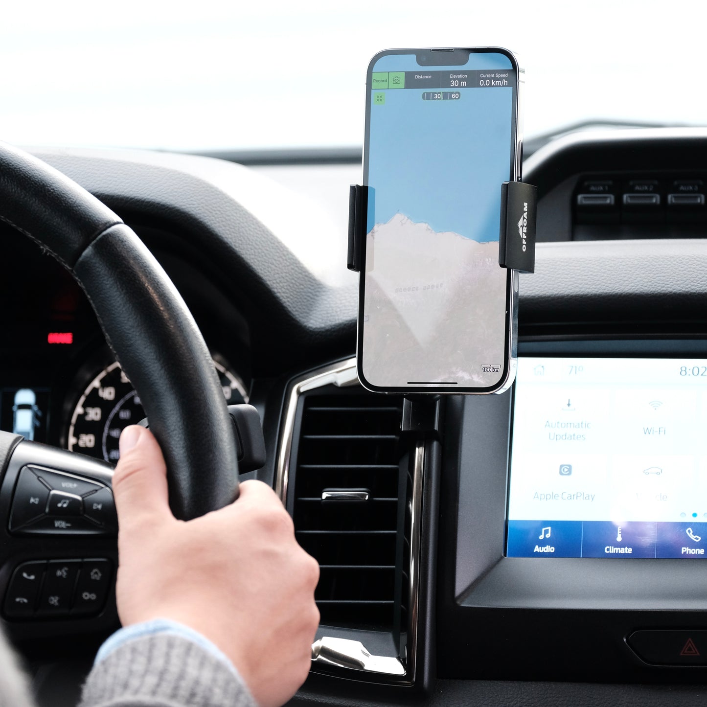 Image of Offroam Phone Mount installed securely in Ford Ranger 2019-2023. This premium phone mount installs easily without drilling or glue. Spring loaded Universal holder for use with any phone. Perfect placement without blocking screens, driver view, or air flow. Fully adjustable positioning.