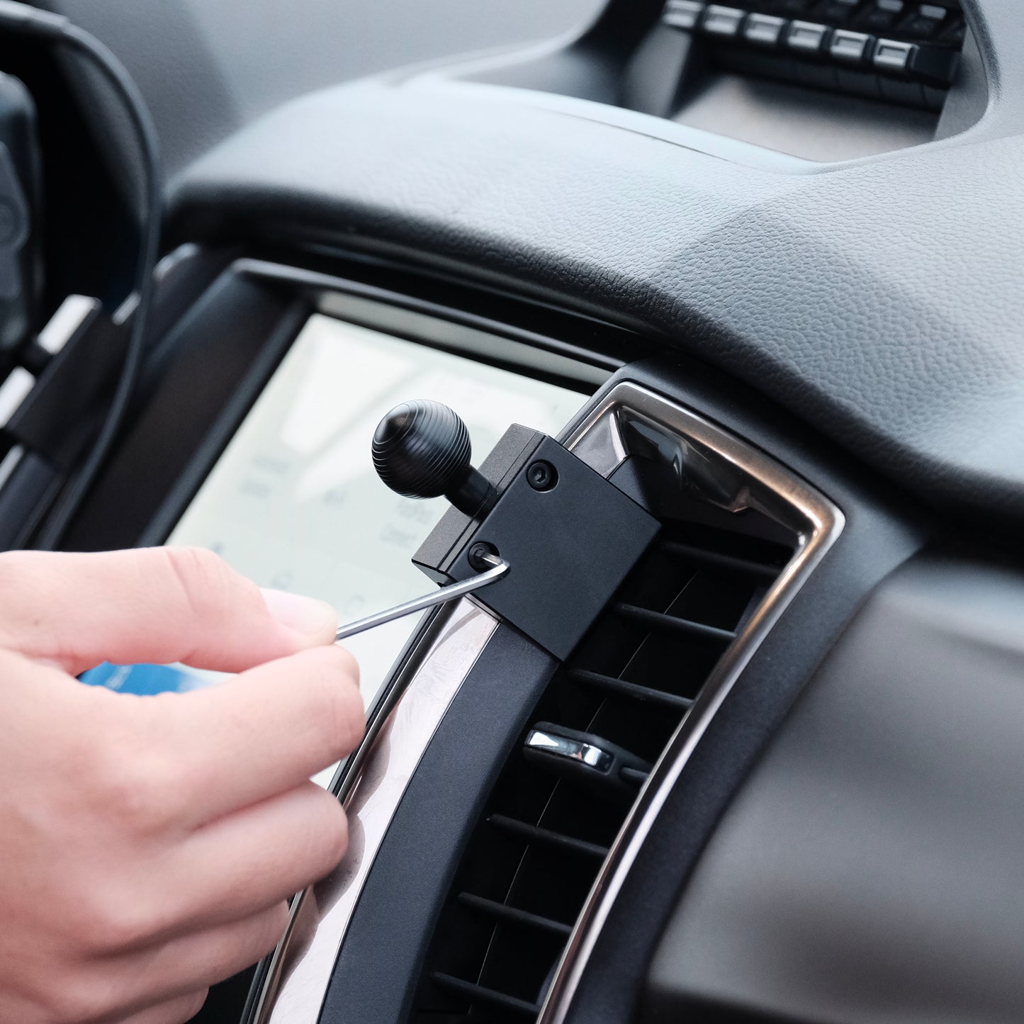 Image of Offroam Mounting Base installed securely in Ford Ranger 2019-2023. This premium all metal phone mounting base installs easily without drilling or glue. Perfect placement without blocking screens, driver view, or air flow.
