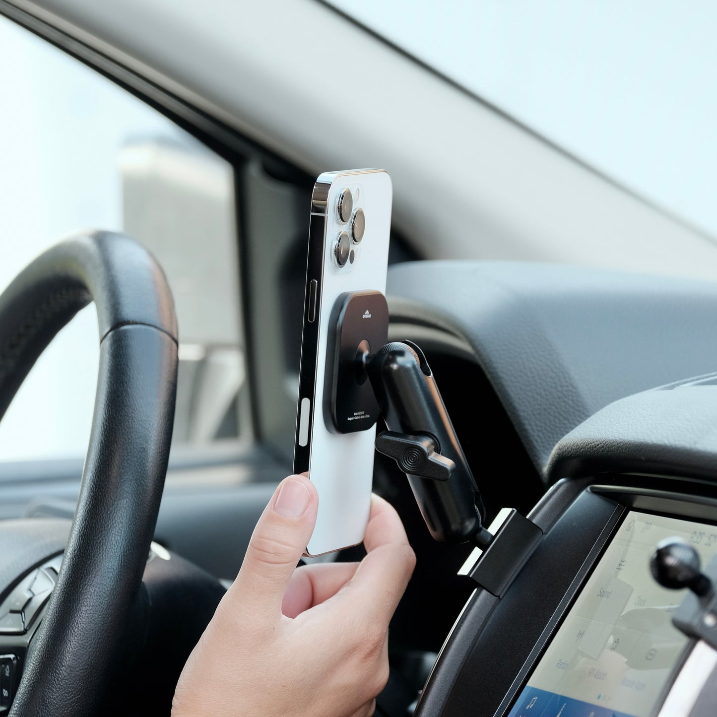 Image of Offroam MagSafe-compatible Phone Mount installed securely in Ford Ranger 2019-2023. This premium phone mount installs easily without drilling or glue. High force magnets hold phone on any trail, road, or track. Perfect placement without blocking screens, driver view, or air flow. Fully adjustable positioning.