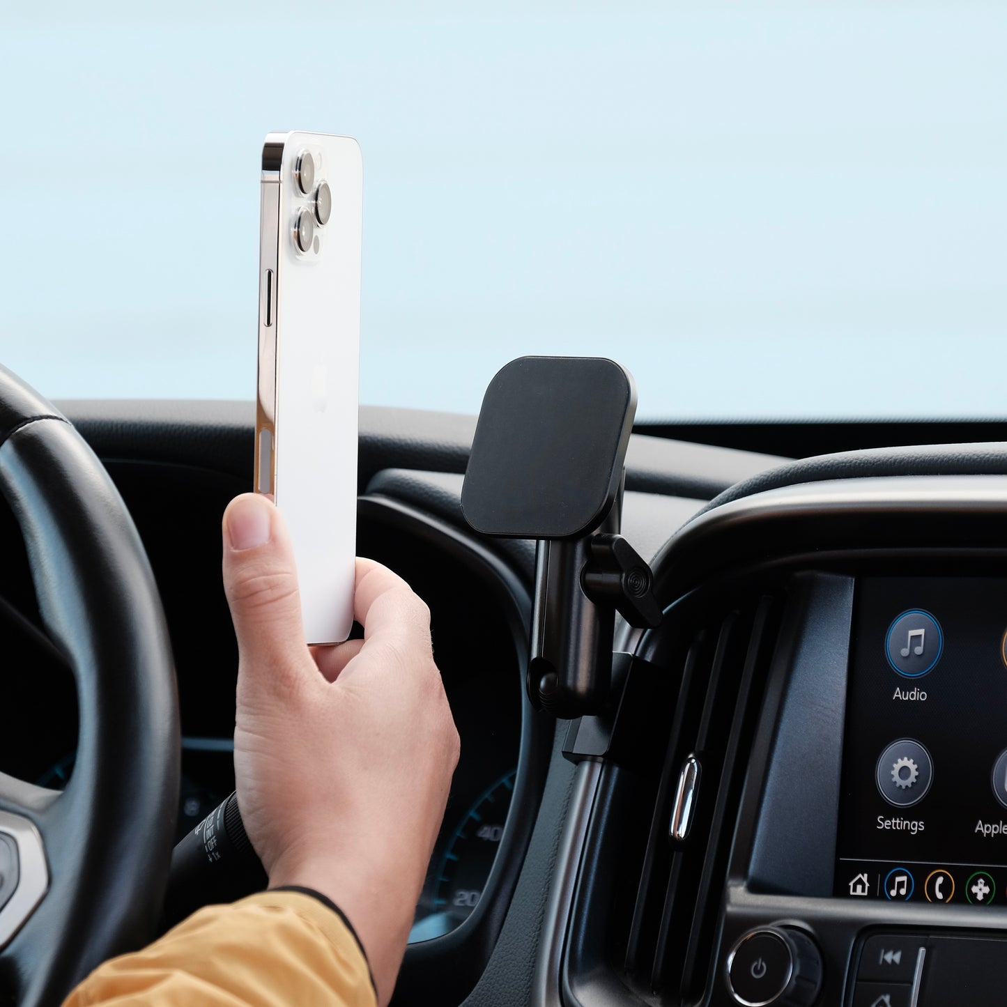 Image of Offroam MagSafe-compatible Phone Mount installed securely in Chevy Colorado | GMC Canyon 2015-2022. This premium phone mount installs easily without drilling or glue. High force magnets hold phone on any trail, road, or track. Perfect placement without blocking screens, driver view, or air flow. Fully adjustable positioning.