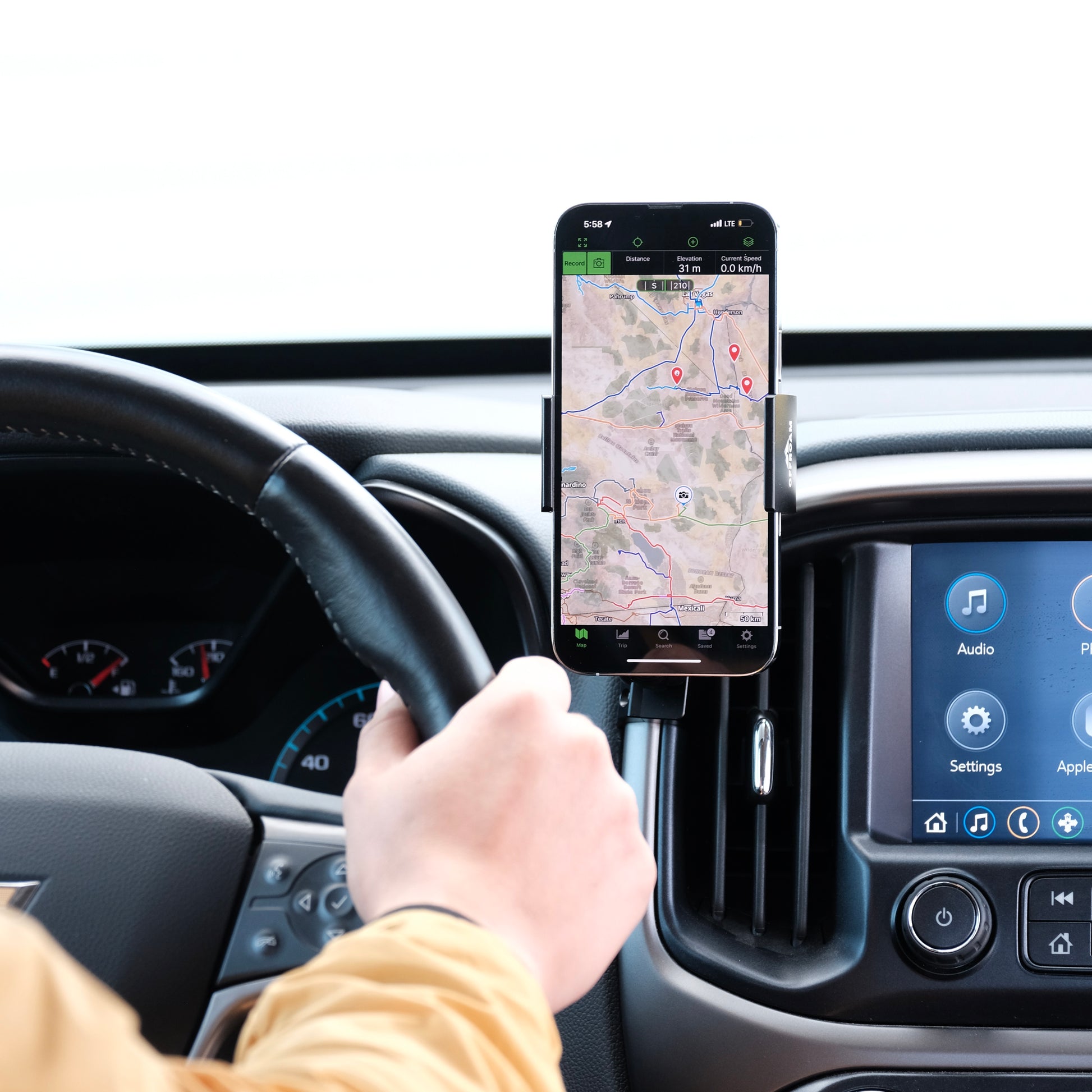 Image of Offroam Phone Mount installed securely in Chevy Colorado | GMC Canyon 2015-2022. This premium phone mount installs easily without drilling or glue. Spring loaded Universal holder for use with any phone. Perfect placement without blocking screens, driver view, or air flow. Fully adjustable positioning.