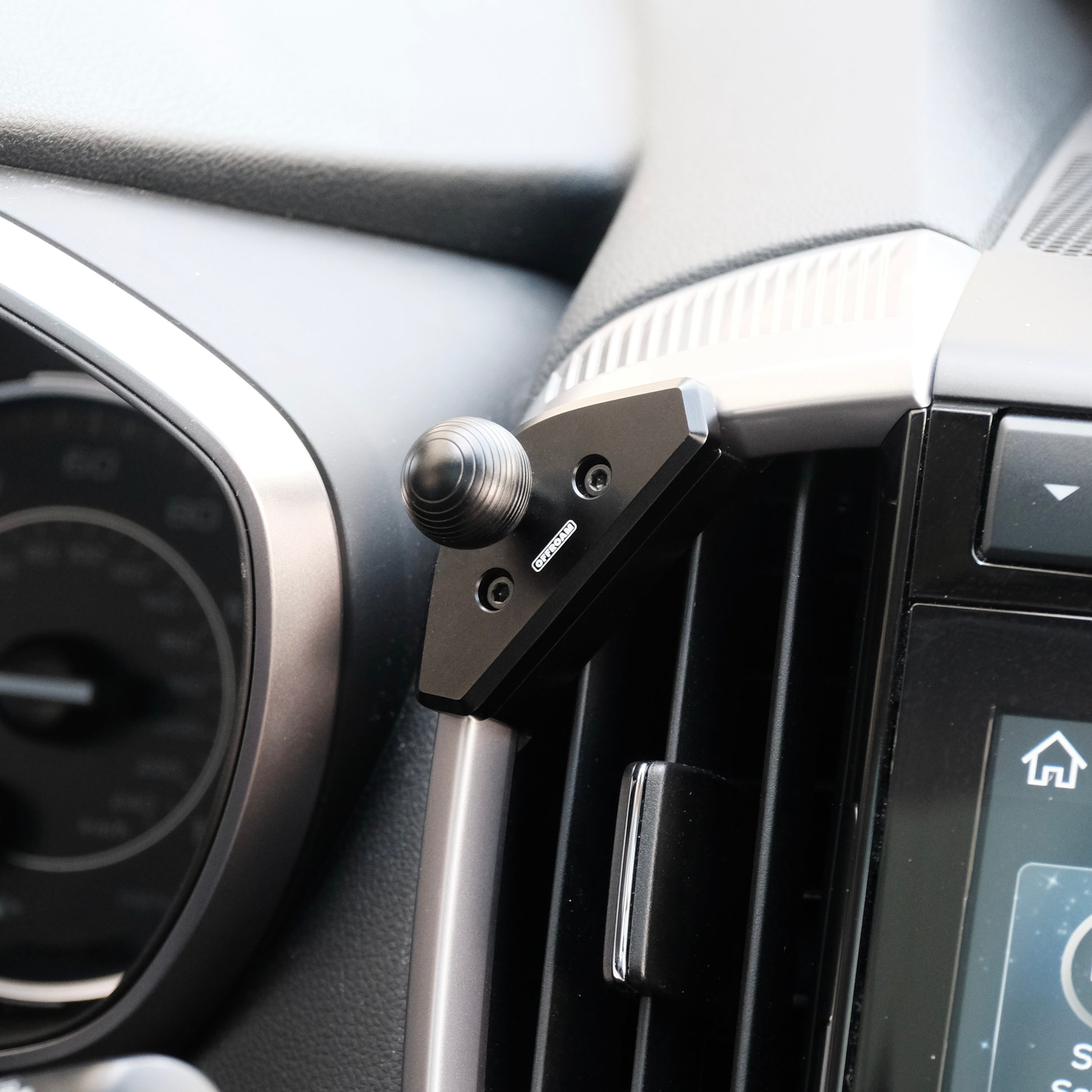 Image of Offroam Mounting Base installed securely in Subaru Ascent 2019-2022. This premium all metal phone mounting base installs easily without drilling or glue. Perfect placement without blocking screens, driver view, or air flow.