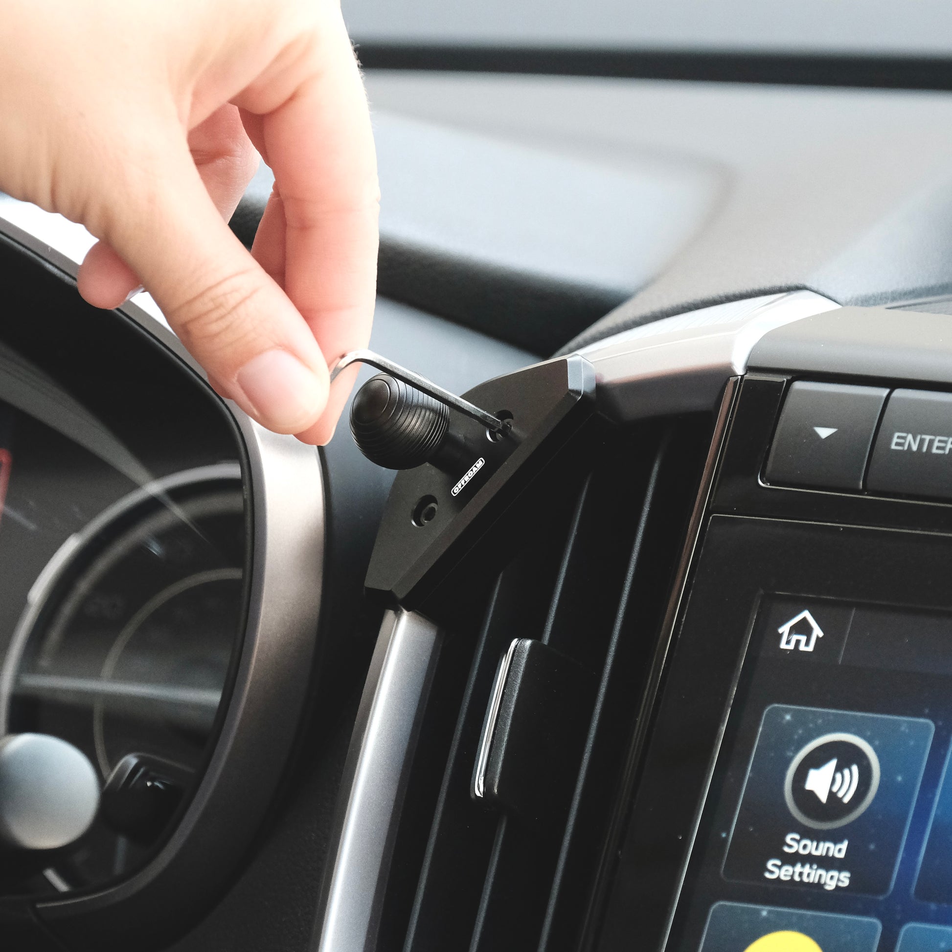 Image of Offroam Mounting Base installed securely in Subaru Ascent 2019-2022. This premium all metal phone mounting base installs easily without drilling or glue. Perfect placement without blocking screens, driver view, or air flow.