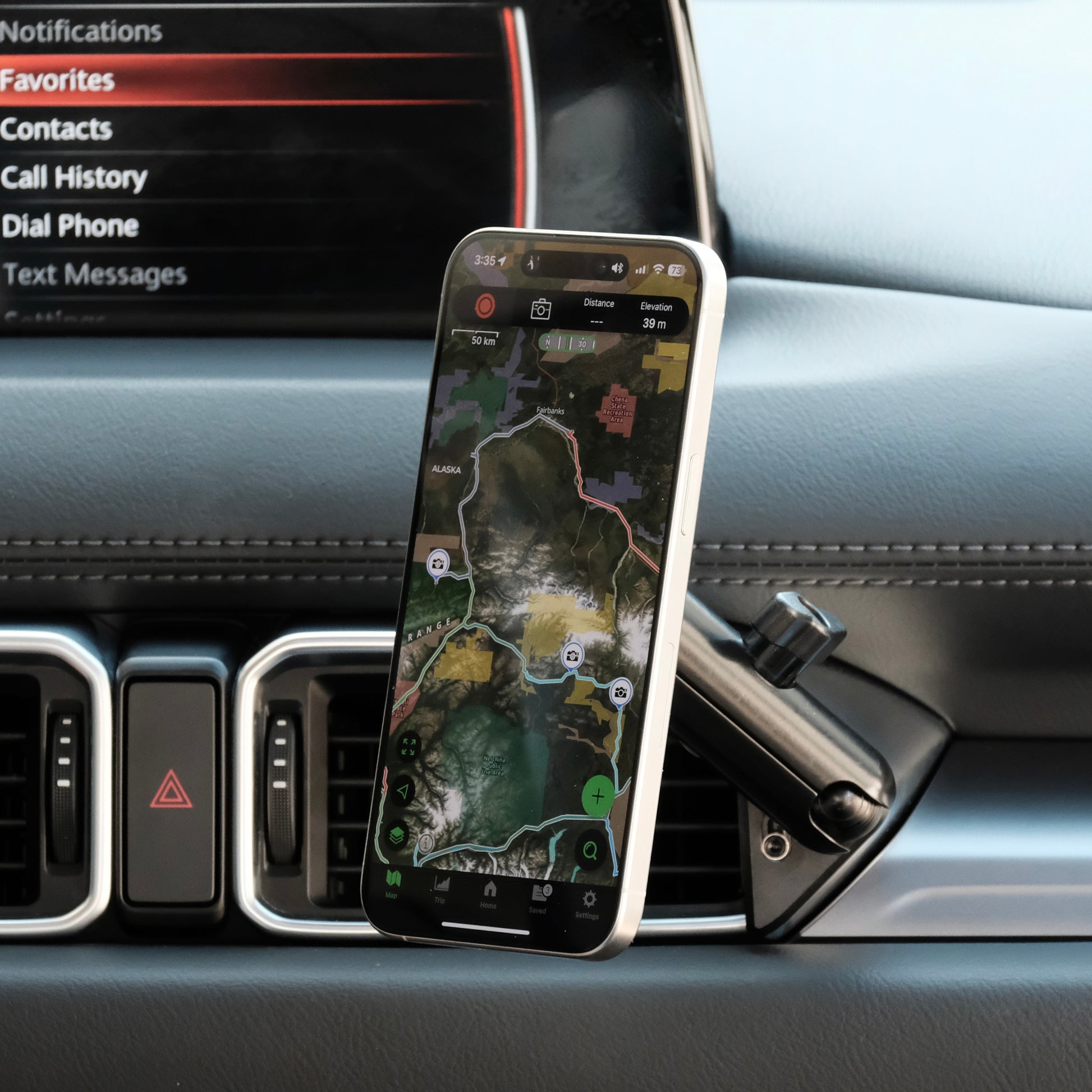 Image of Offroam MagSafe-compatible Phone Mount installed securely in Mazda CX-5 2017-2025. This premium phone mount installs easily without drilling or glue. High force magnets hold phone on any trail, road, or track. Perfect placement without blocking screens, driver view, or air flow. Fully adjustable positioning.