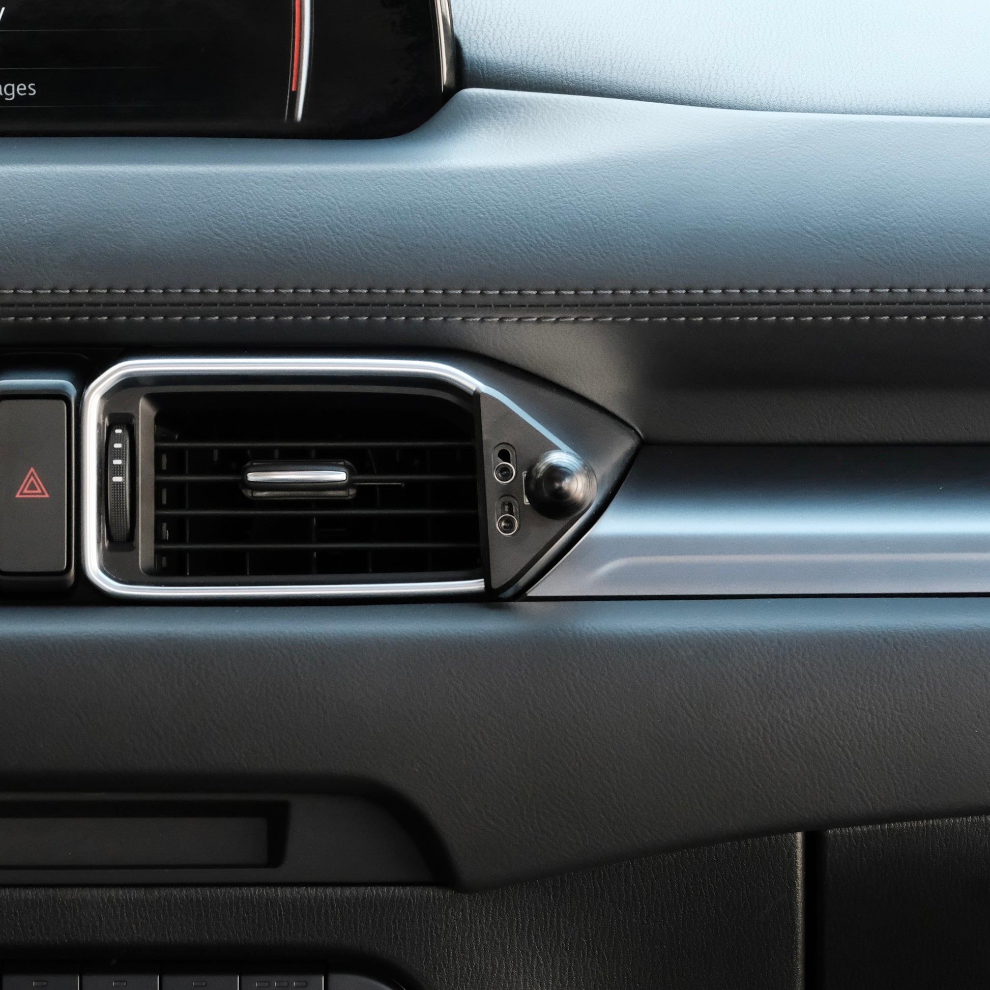 Image of Offroam Mounting Base installed securely in Mazda CX-5 2017-2025. This premium all metal phone mounting base installs easily without drilling or glue. Perfect placement without blocking screens, driver view, or air flow.