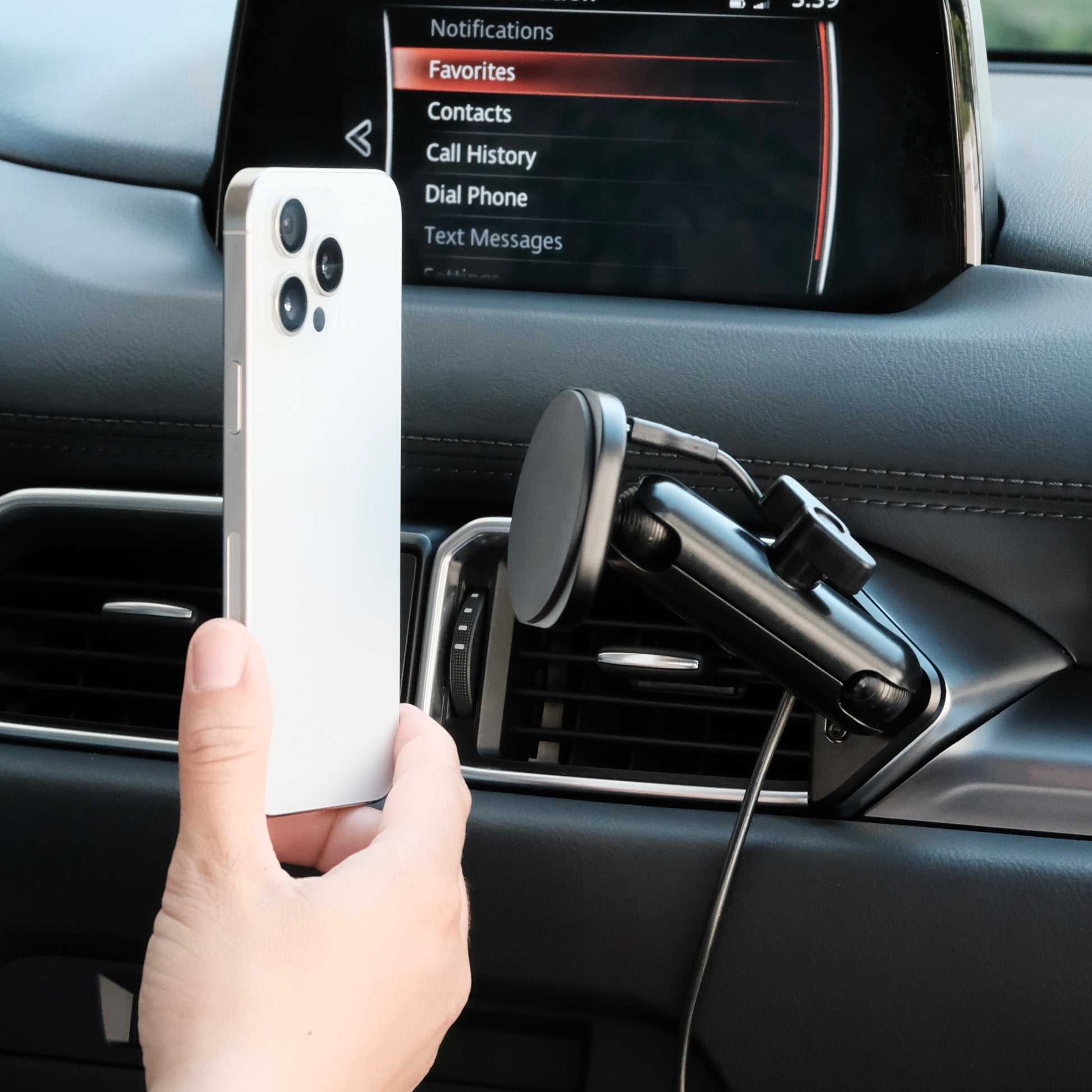 Image of Offroam MagSafe-compatible Phone Mount installed securely in Mazda CX-5 2017-2025. This premium phone mount installs easily without drilling or glue. High force magnets hold phone on any trail, road, or track. Perfect placement without blocking screens, driver view, or air flow. Fully adjustable positioning.