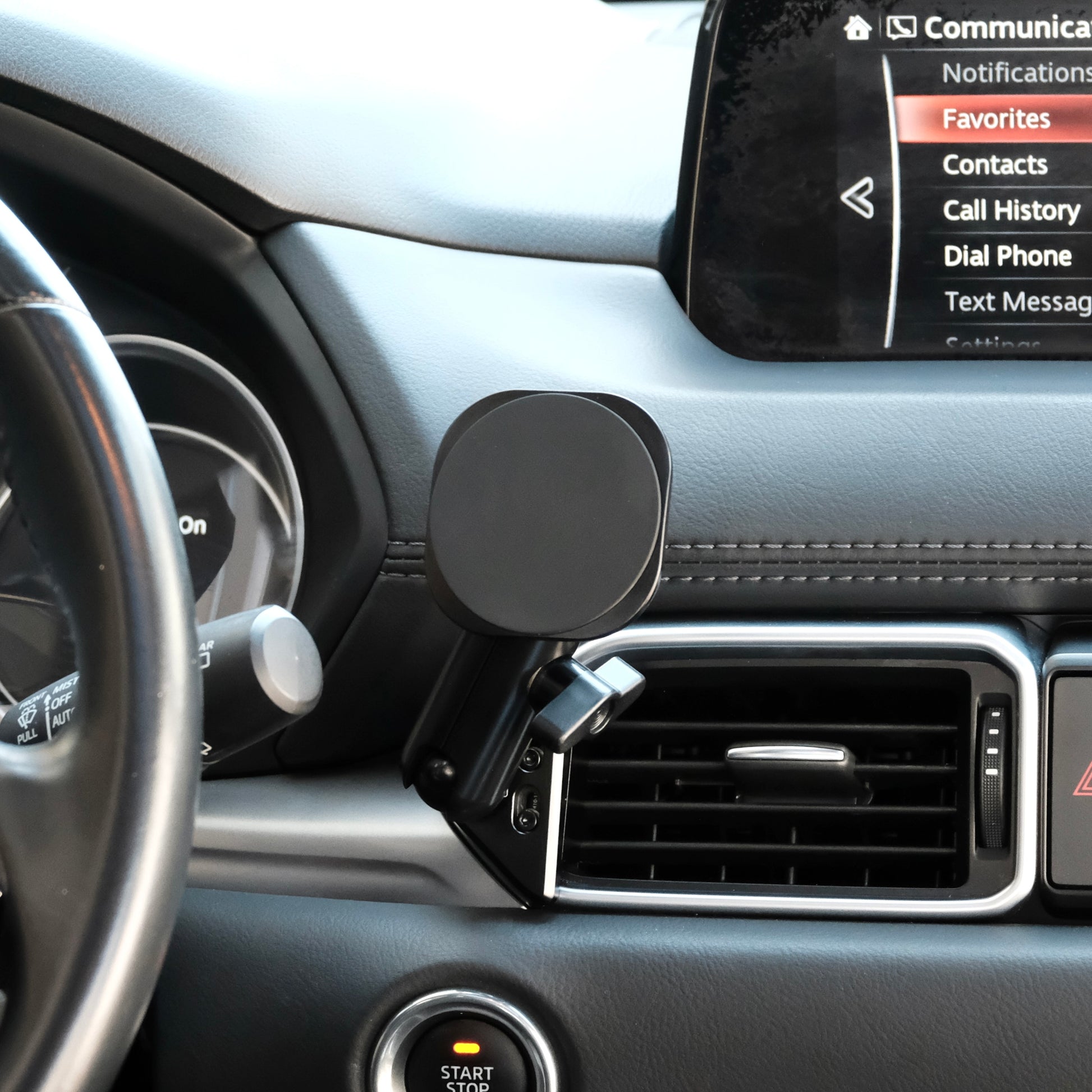 Image of Offroam MagSafe-compatible Phone Mount installed securely in Mazda CX-5 2017-2025. This premium phone mount installs easily without drilling or glue. High force magnets hold phone on any trail, road, or track. Perfect placement without blocking screens, driver view, or air flow. Fully adjustable positioning.