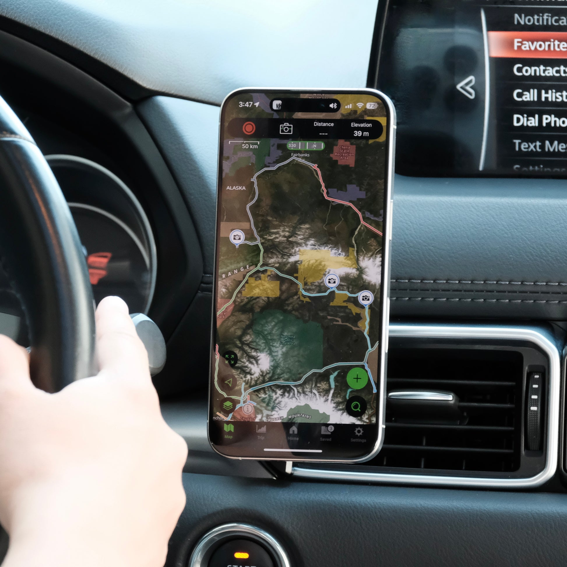 Image of Offroam MagSafe-compatible Phone Mount installed securely in Mazda CX-5 2017-2025. This premium phone mount installs easily without drilling or glue. High force magnets hold phone on any trail, road, or track. Perfect placement without blocking screens, driver view, or air flow. Fully adjustable positioning.