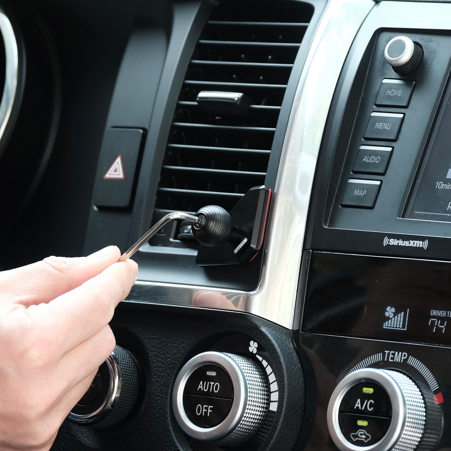 Image of Offroam Mounting Base installed securely in Toyota Tundra 2007-2013 | Sequoia 2008-2022. This premium all metal phone mounting base installs easily without drilling or glue. Perfect placement without blocking screens, driver view, or air flow.