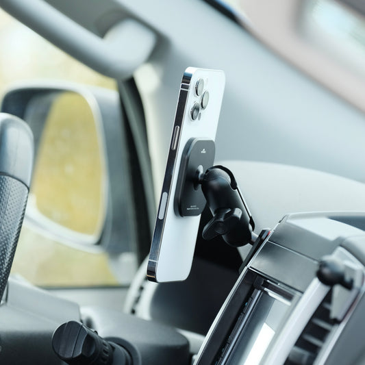 Image of Offroam MagSafe-compatible Phone Mount installed securely in Nissan Frontier 2009-2021 | Xterra 2009-2015. This premium phone mount installs easily without drilling or glue. High force magnets hold phone on any trail, road, or track. Perfect placement without blocking screens, driver view, or air flow. Fully adjustable positioning.