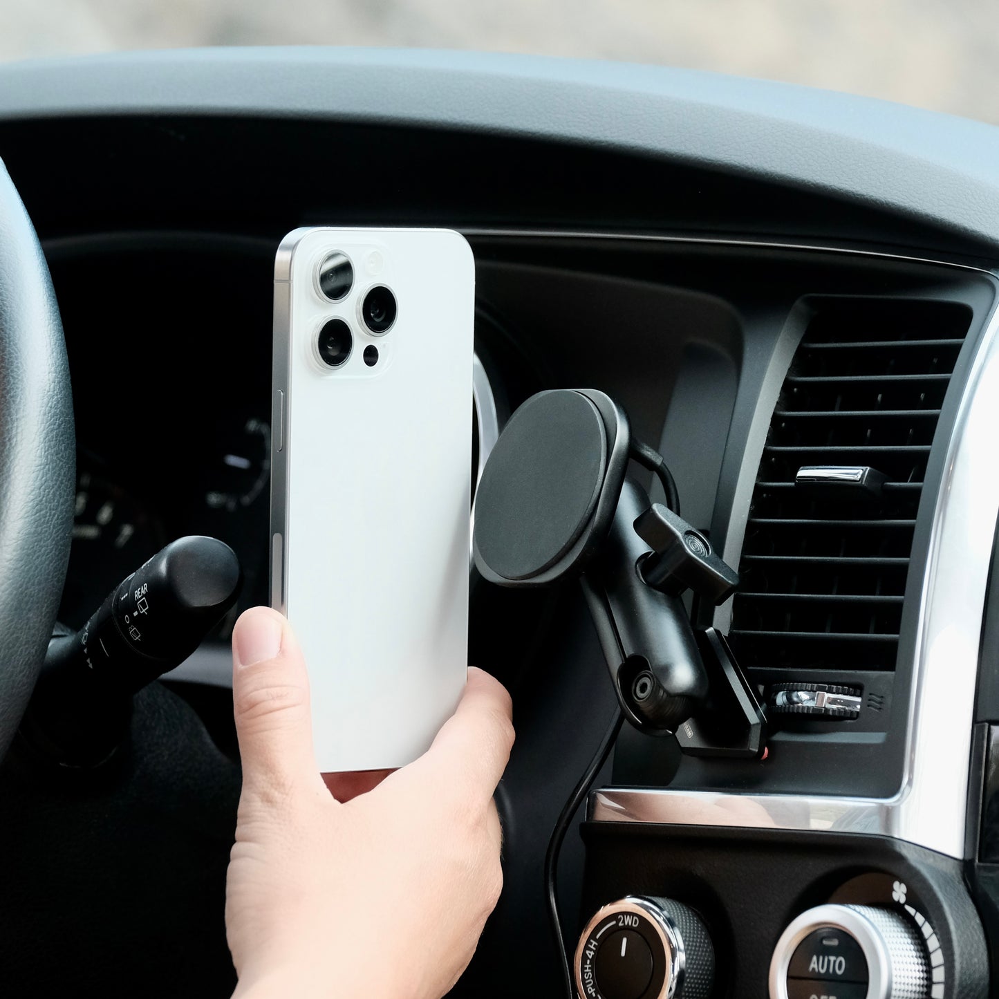 Image of Offroam MagSafe-compatible Phone Mount installed securely in Toyota Tundra 2007-2013 | Sequoia 2008-2022. This premium phone mount installs easily without drilling or glue. High force magnets hold phone on any trail, road, or track. Perfect placement without blocking screens, driver view, or air flow. Fully adjustable positioning.