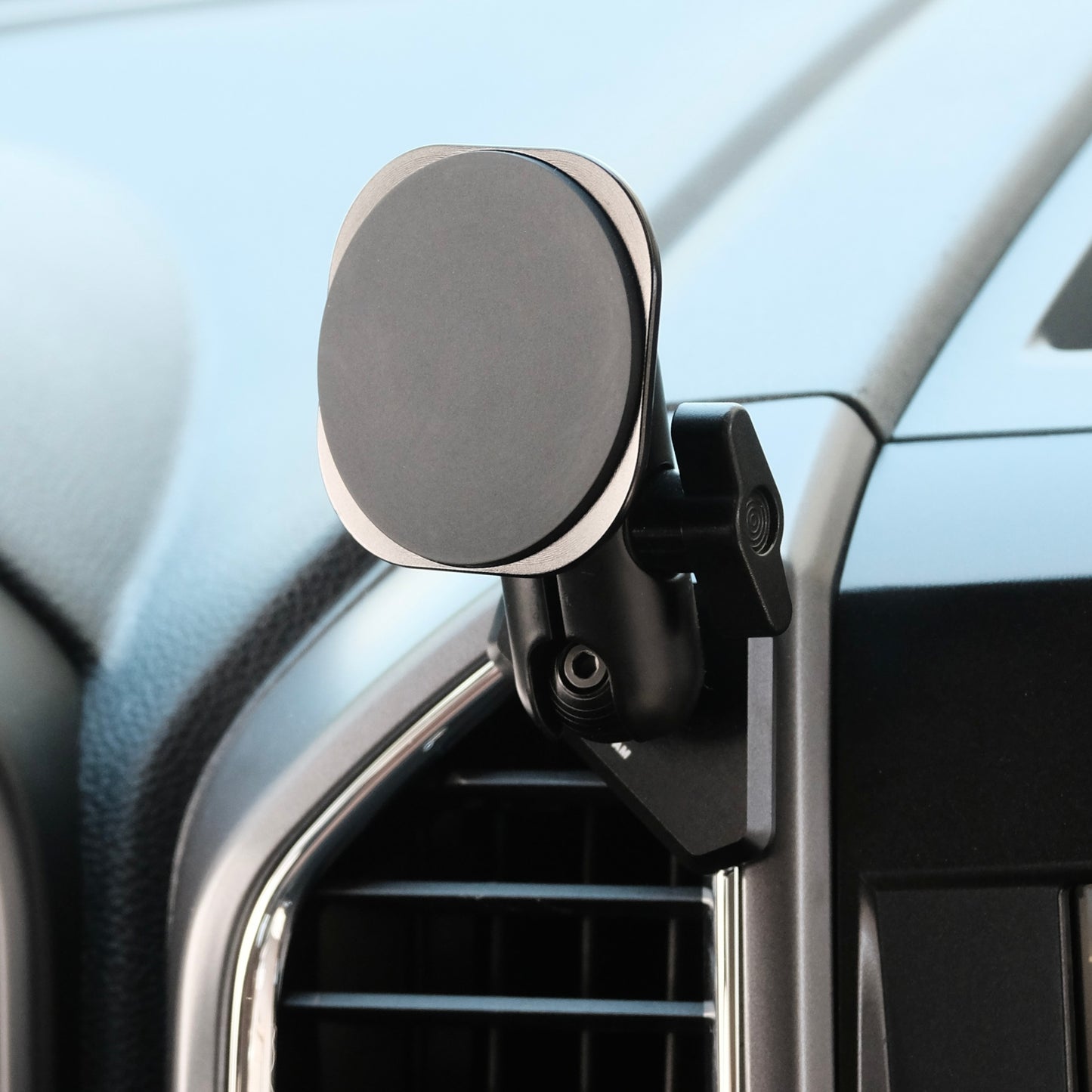 Image of Offroam MagSafe-compatible Phone Mount installed securely in Ford F-150 2015-2020 | Super Duty 2017-2021 & 2022 (XL and XLT) | Expedition 2018-2021. This premium phone mount installs easily without drilling or glue. High force magnets hold phone on any trail, road, or track. Perfect placement without blocking screens, driver view, or air flow. Fully adjustable positioning.