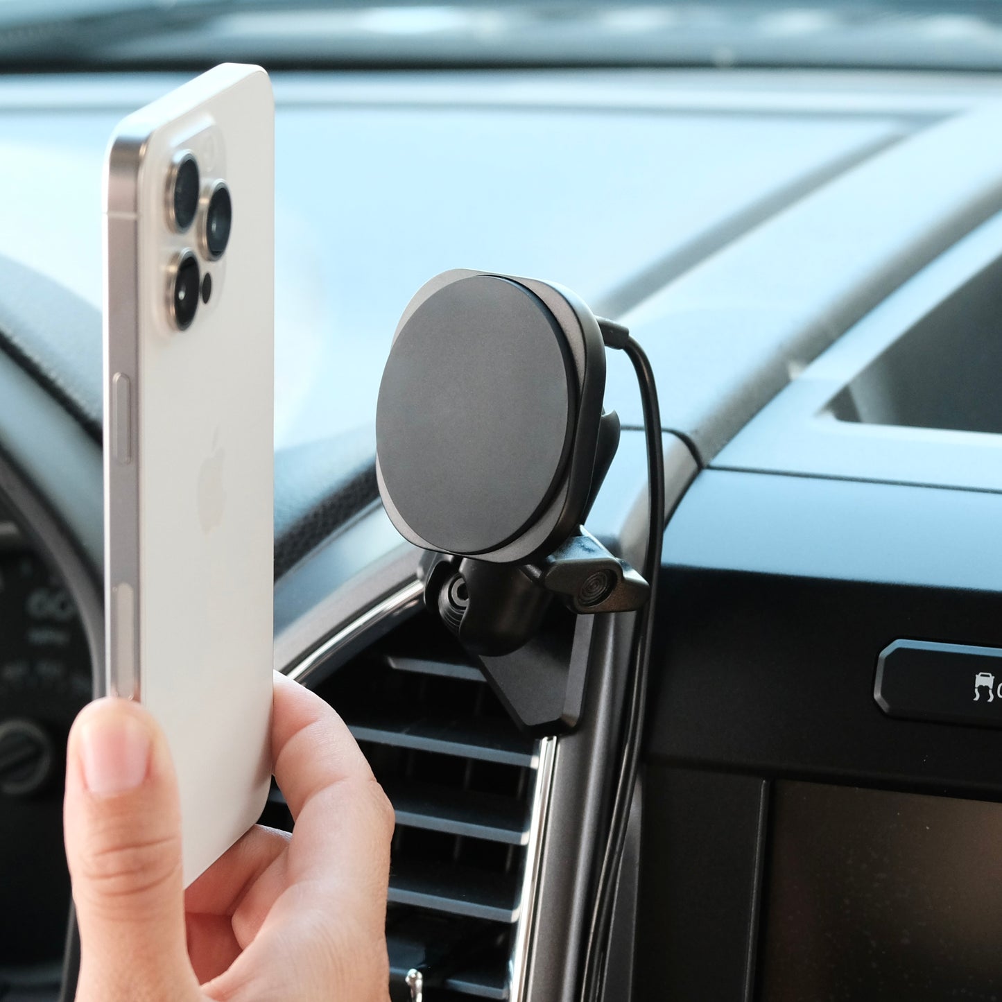 Image of Offroam MagSafe-compatible Phone Mount installed securely in Ford F-150 2015-2020 | Super Duty 2017-2021 & 2022 (XL and XLT) | Expedition 2018-2021. This premium phone mount installs easily without drilling or glue. High force magnets hold phone on any trail, road, or track. Perfect placement without blocking screens, driver view, or air flow. Fully adjustable positioning.