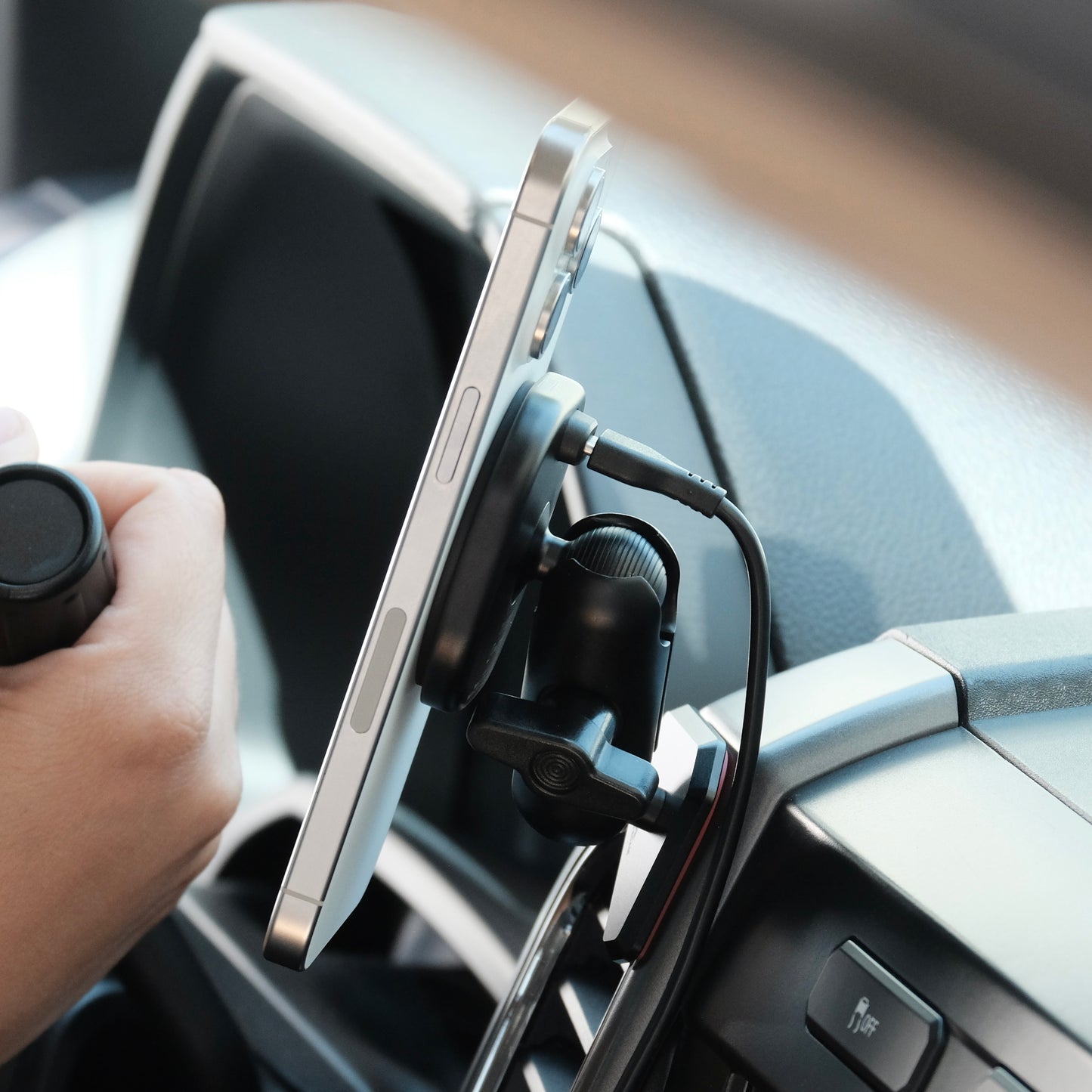 Image of Offroam MagSafe-compatible Phone Mount installed securely in Ford F-150 2015-2020 | Super Duty 2017-2021 & 2022 (XL and XLT) | Expedition 2018-2021. This premium phone mount installs easily without drilling or glue. High force magnets hold phone on any trail, road, or track. Perfect placement without blocking screens, driver view, or air flow. Fully adjustable positioning.