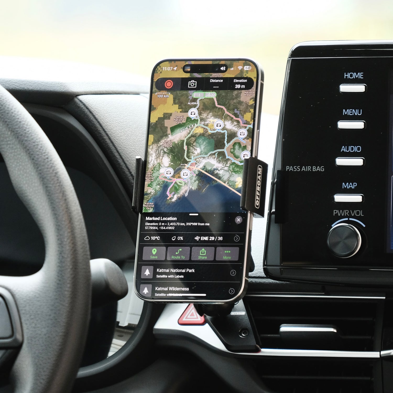 Image of Offroam Phone Mount installed securely in Toyota Sienna 2021-2025. This premium phone mount installs easily without drilling or glue. Spring loaded Universal holder for use with any phone. Perfect placement without blocking screens, driver view, or air flow. Fully adjustable positioning.