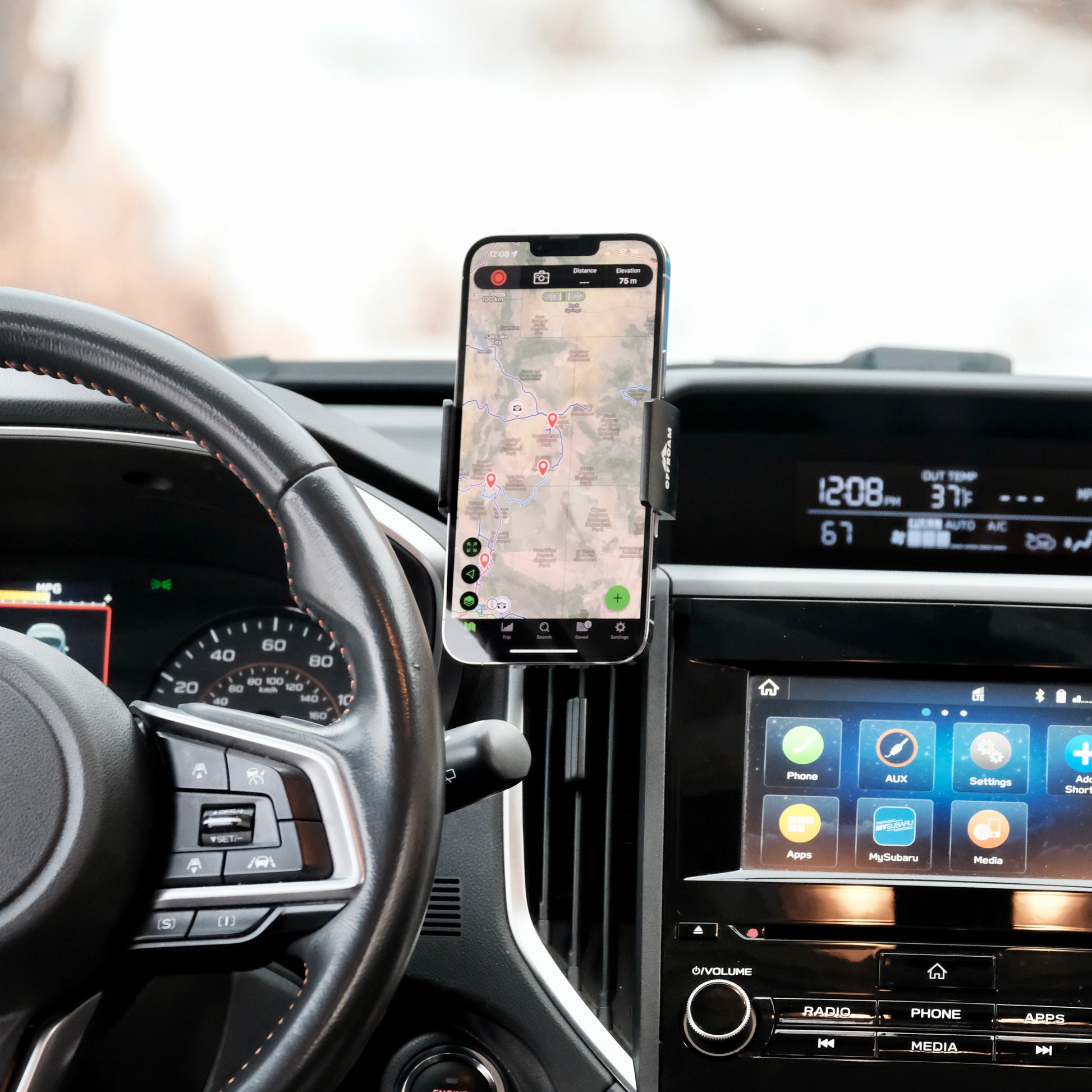 Image of Offroam Phone Mount installed securely in Subaru Crosstrek 2018-2023 | Forester 2019-2024| Impreza 2017-2023. This premium phone mount installs easily without drilling or glue. Spring loaded Universal holder for use with any phone. Perfect placement without blocking screens, driver view, or air flow. Fully adjustable positioning.