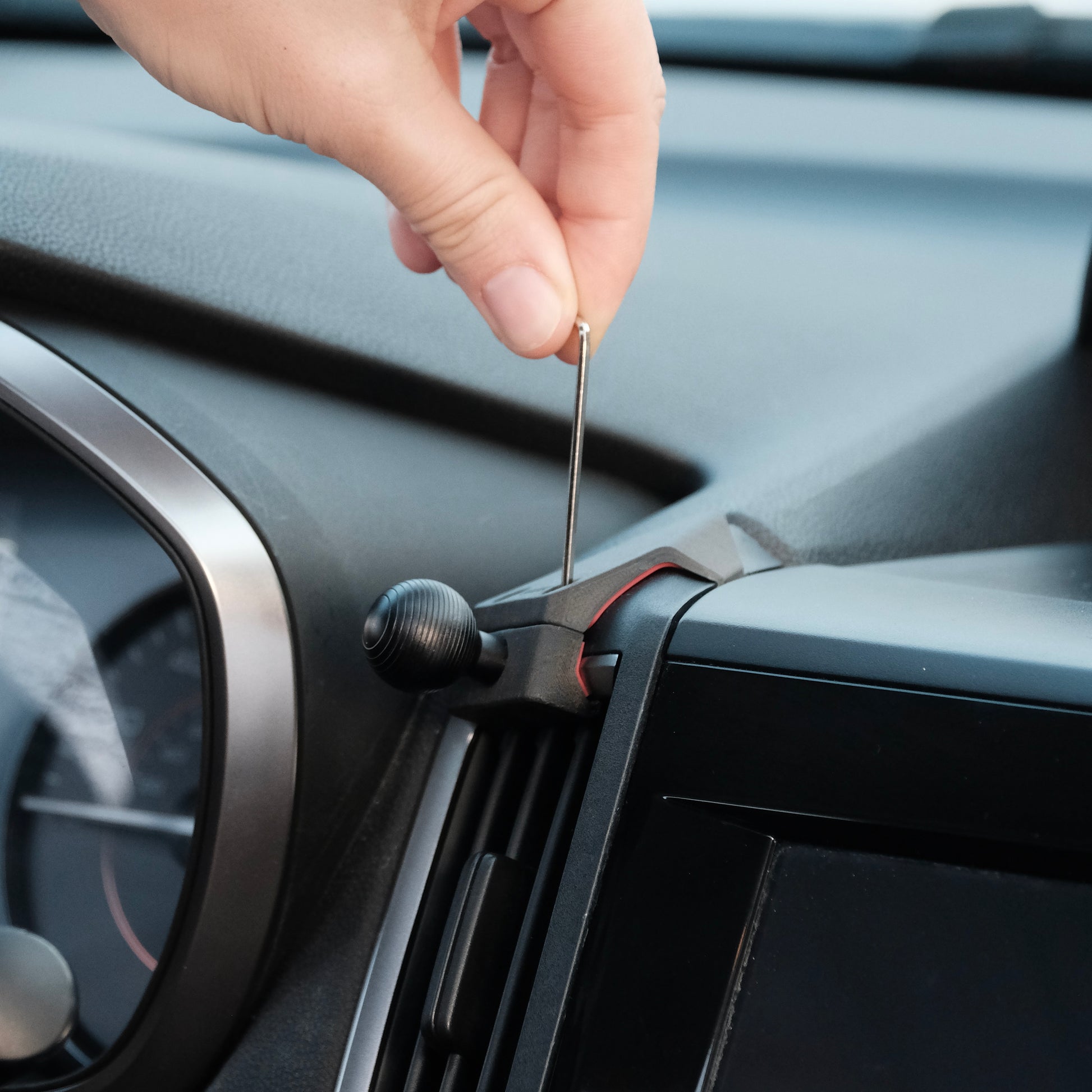 Image of Offroam Mounting Base installed securely in Subaru Crosstrek 2018-2023 | Forester 2019-2024| Impreza 2017-2023. This premium all metal phone mounting base installs easily without drilling or glue. Perfect placement without blocking screens, driver view, or air flow.