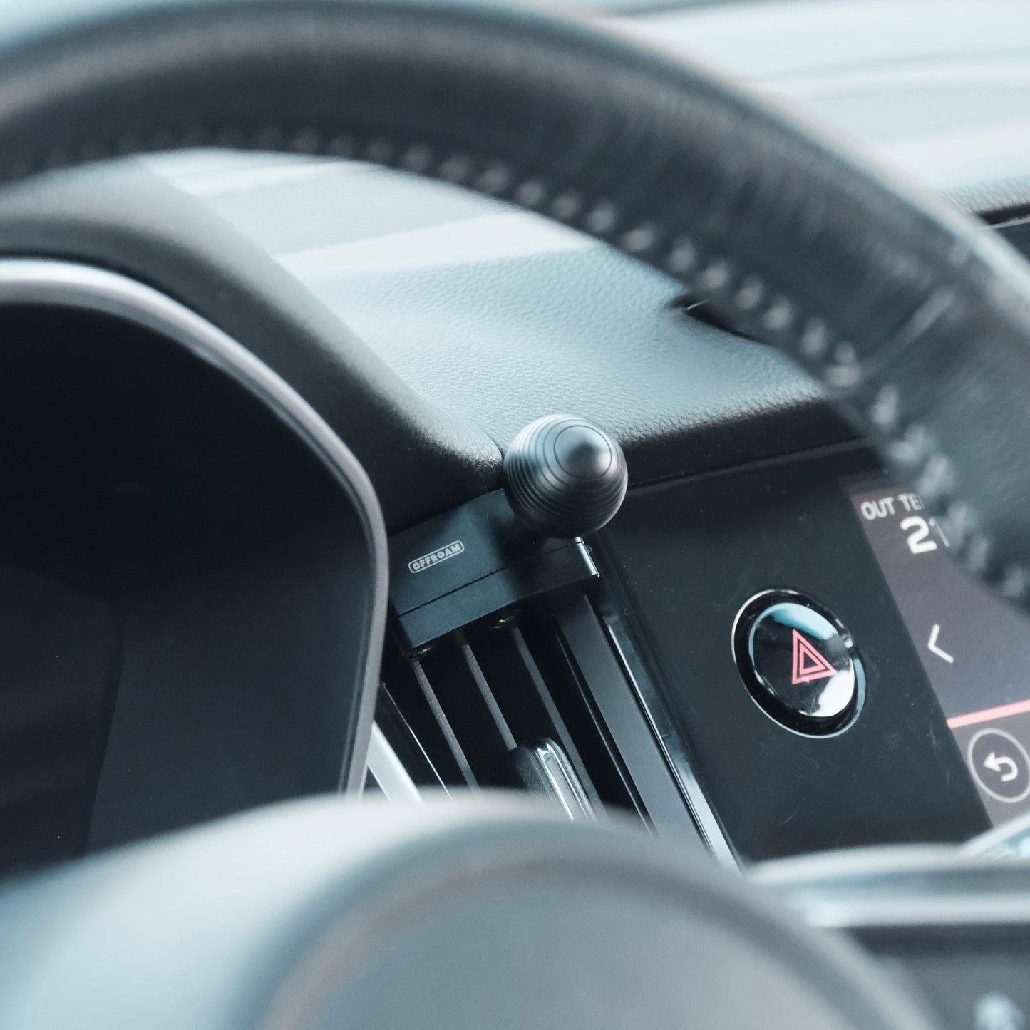 Image of Offroam Mounting Base installed securely in Subaru Outback | Legacy 2020-2025. This premium all metal phone mounting base installs easily without drilling or glue. Perfect placement without blocking screens, driver view, or air flow.
