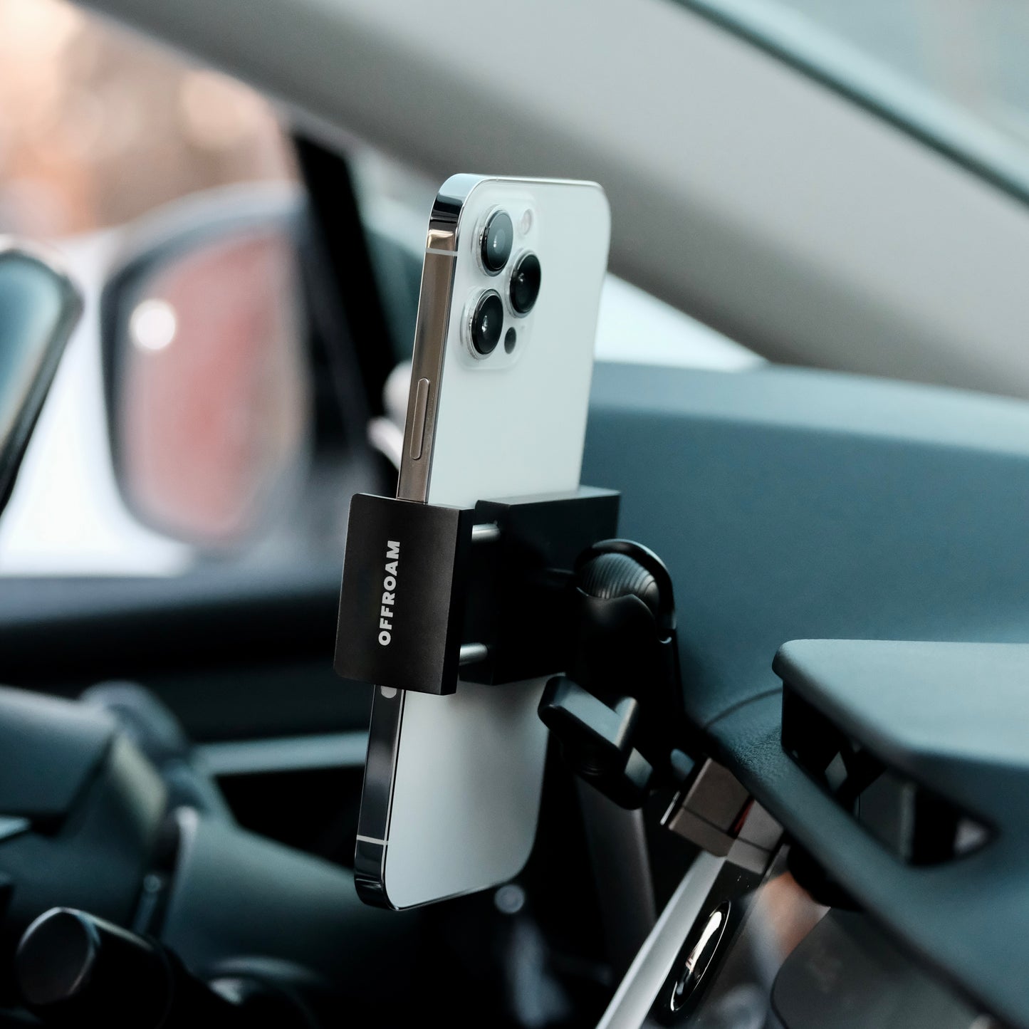 Image of Offroam Phone Mount installed securely in Subaru Outback | Legacy 2020-2025. This premium phone mount installs easily without drilling or glue. Spring loaded Universal holder for use with any phone. Perfect placement without blocking screens, driver view, or air flow. Fully adjustable positioning.