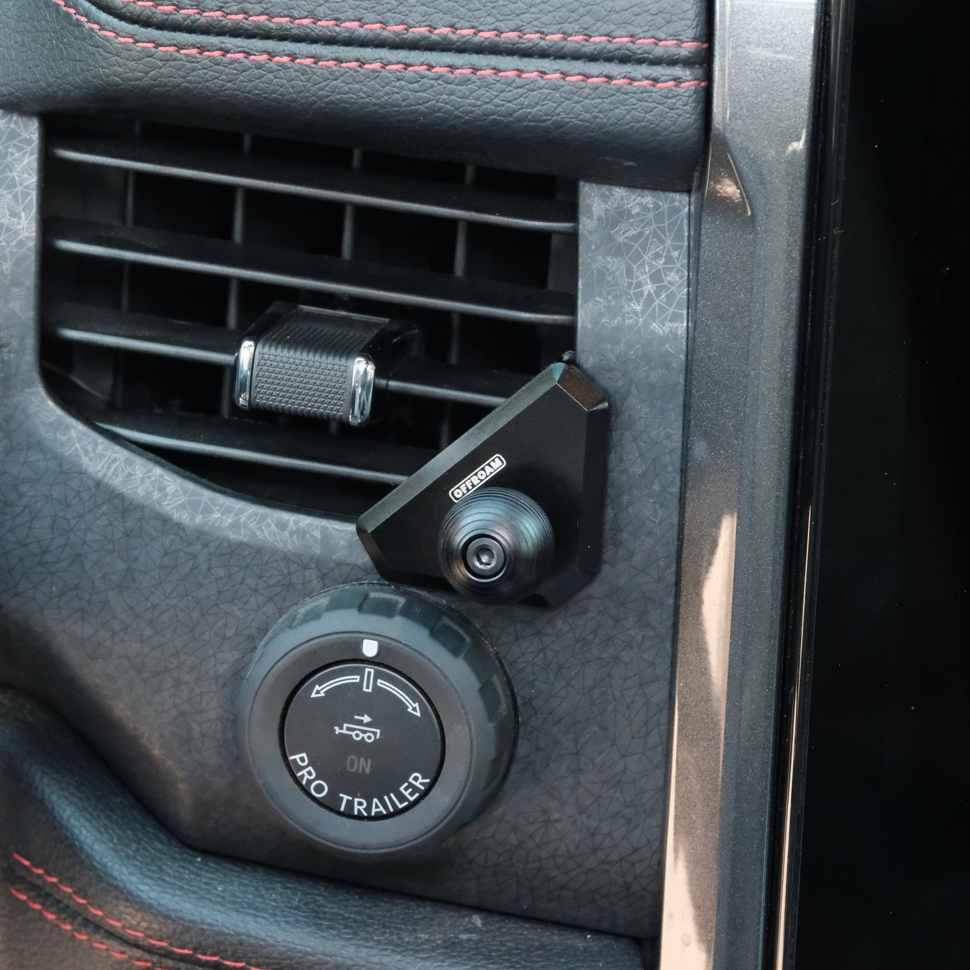Image of Offroam Mounting Base installed securely in Ford F-150 Lightning 2022-2025 (Lariat & Platinum) | Expedition 2022-2024. This premium all metal phone mounting base installs easily without drilling or glue. Perfect placement without blocking screens, driver view, or air flow.
