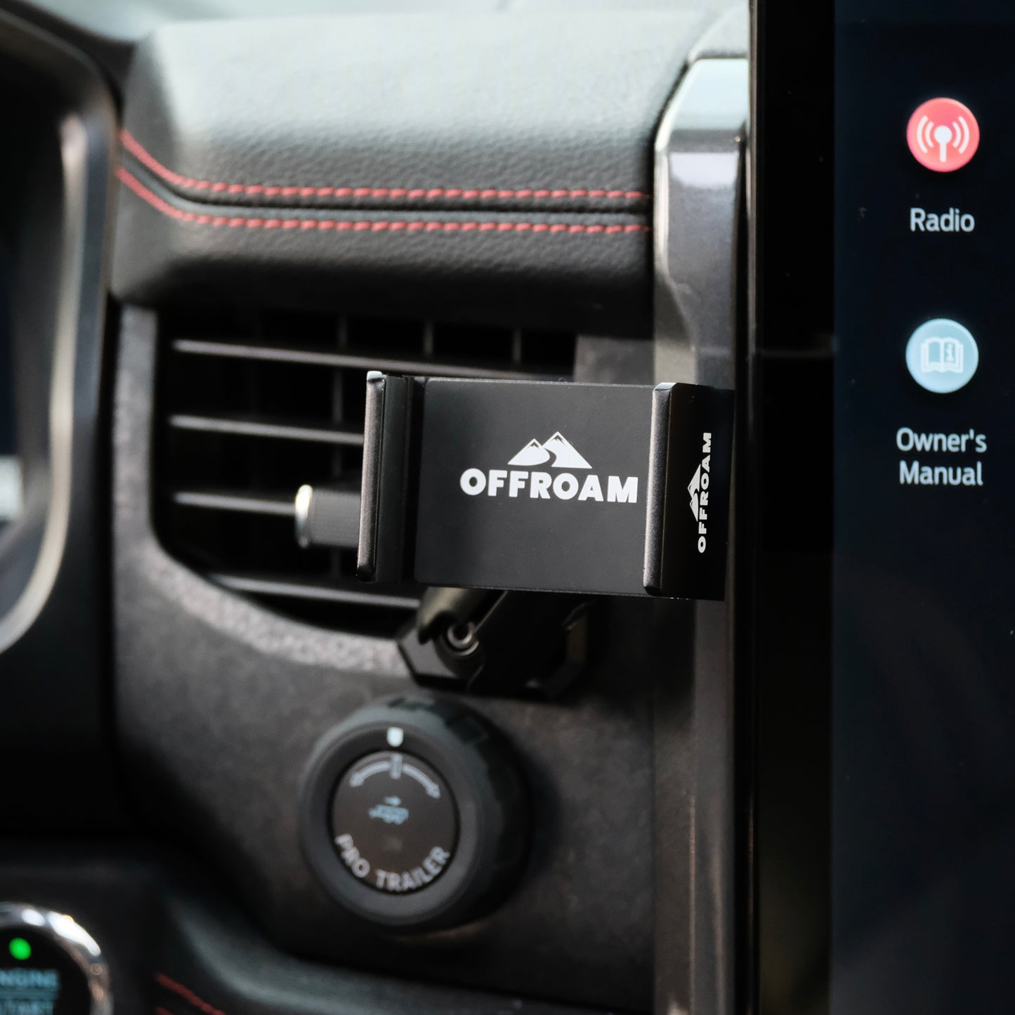 Image of Offroam Phone Mount installed securely in Ford F-150 Lightning 2022-2025 (Lariat & Platinum) | Expedition 2022-2024. This premium phone mount installs easily without drilling or glue. Spring loaded Universal holder for use with any phone. Perfect placement without blocking screens, driver view, or air flow. Fully adjustable positioning.