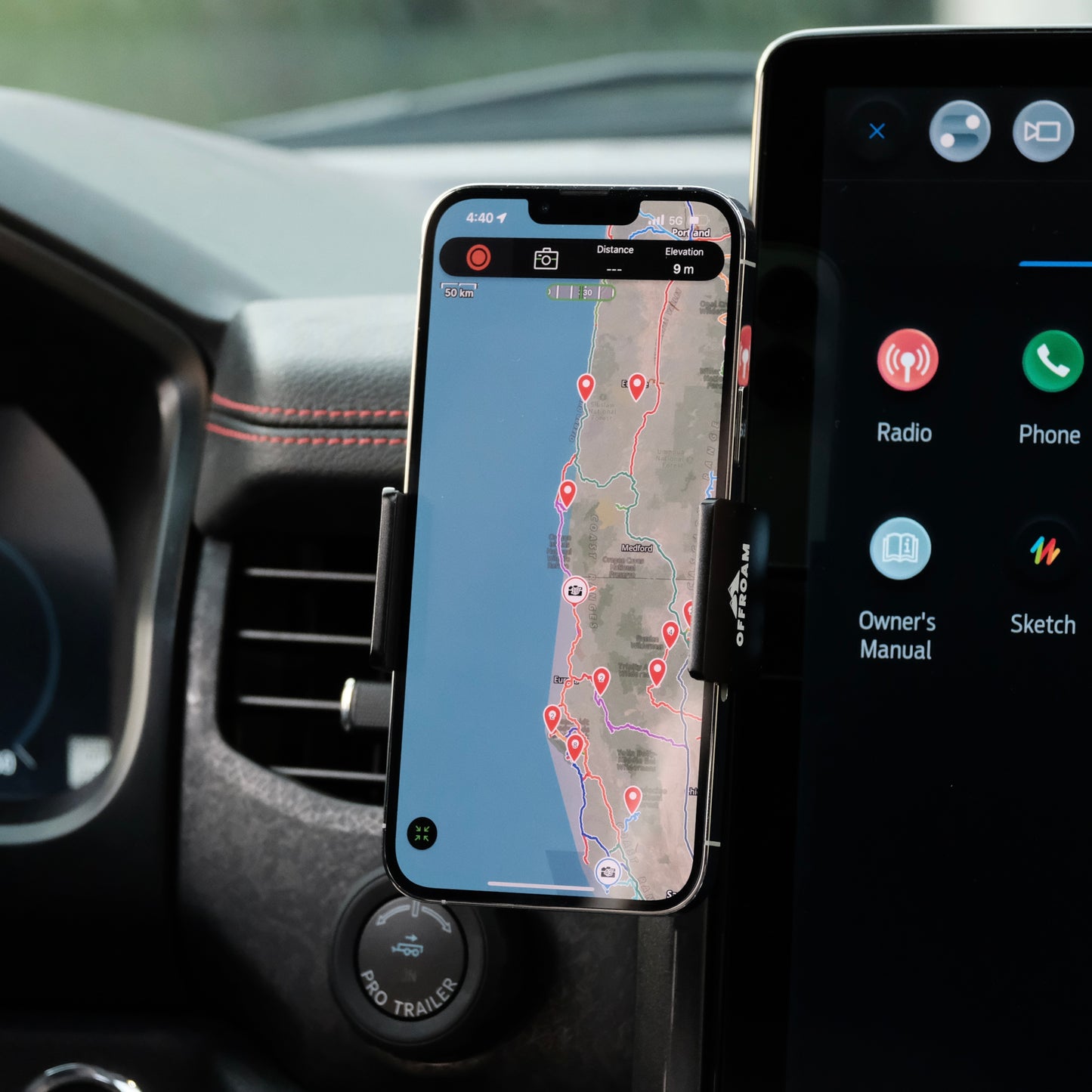 Image of Offroam Phone Mount installed securely in Ford F-150 Lightning 2022-2025 (Lariat & Platinum) | Expedition 2022-2024. This premium phone mount installs easily without drilling or glue. Spring loaded Universal holder for use with any phone. Perfect placement without blocking screens, driver view, or air flow. Fully adjustable positioning.