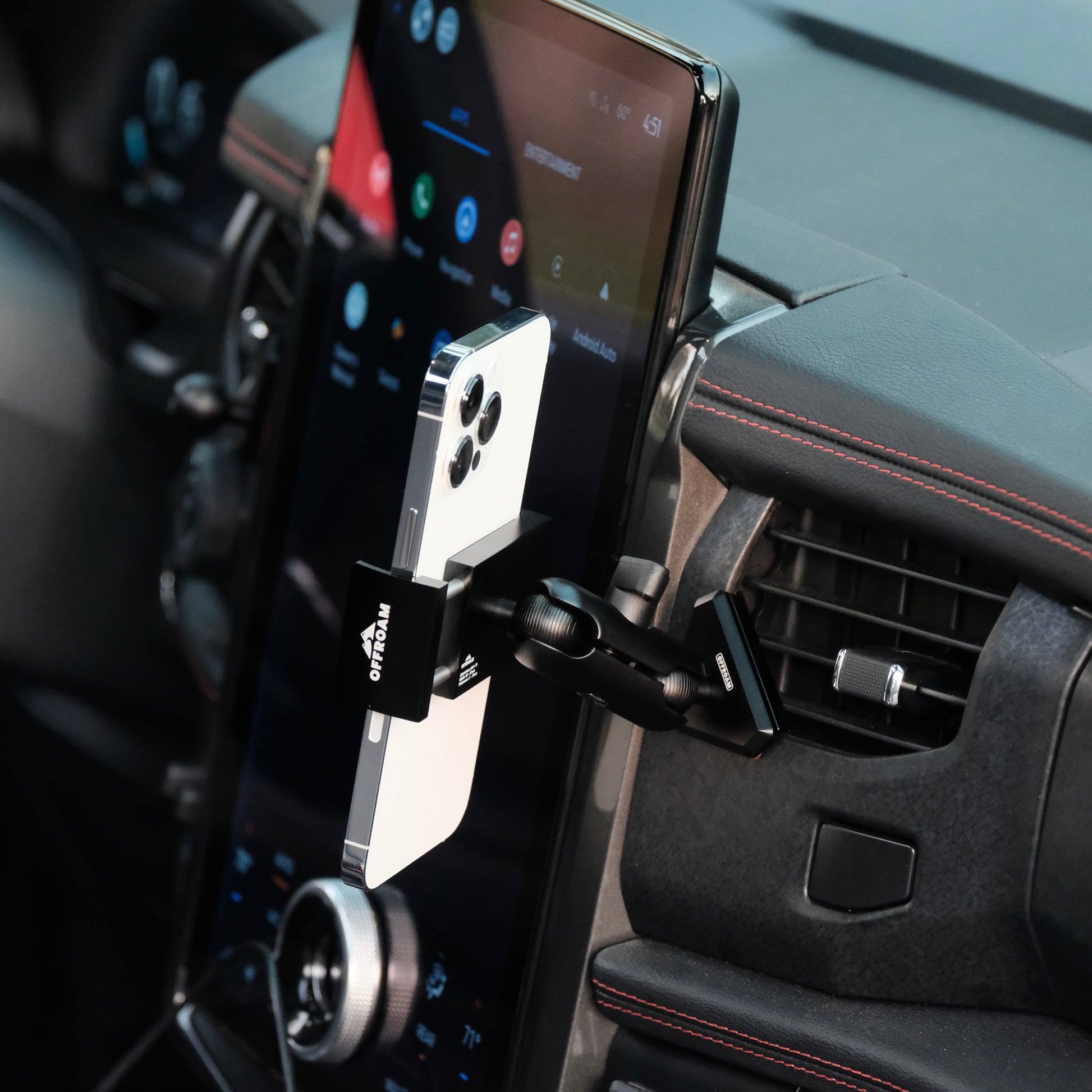 Image of Offroam Phone Mount installed securely in Ford F-150 Lightning 2022-2025 (Lariat & Platinum) | Expedition 2022-2024. This premium phone mount installs easily without drilling or glue. Spring loaded Universal holder for use with any phone. Perfect placement without blocking screens, driver view, or air flow. Fully adjustable positioning.
