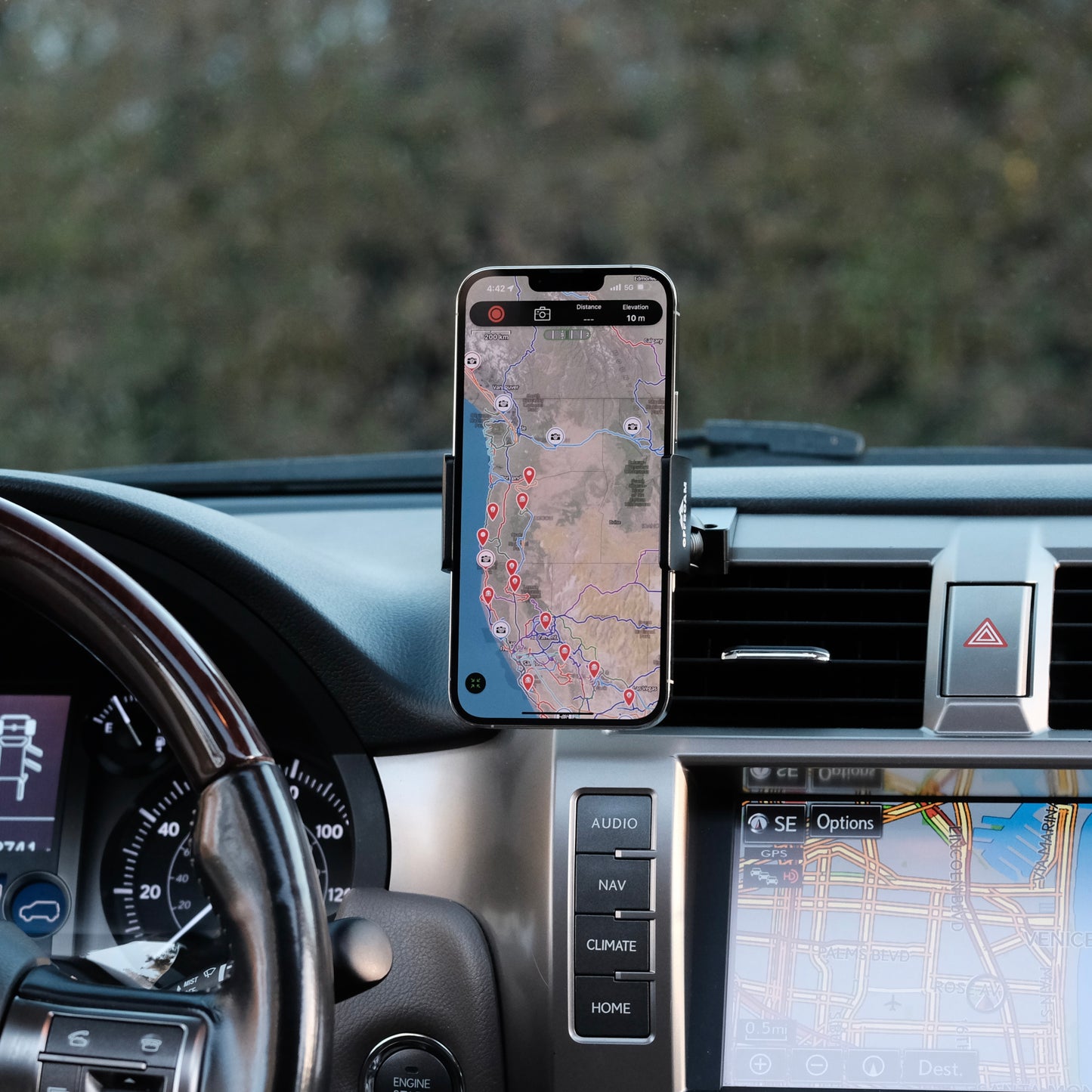 Image of Offroam Phone Mount installed securely in Lexus GX460 2010-2021. This premium phone mount installs easily without drilling or glue. Spring loaded Universal holder for use with any phone. Perfect placement without blocking screens, driver view, or air flow. Fully adjustable positioning.