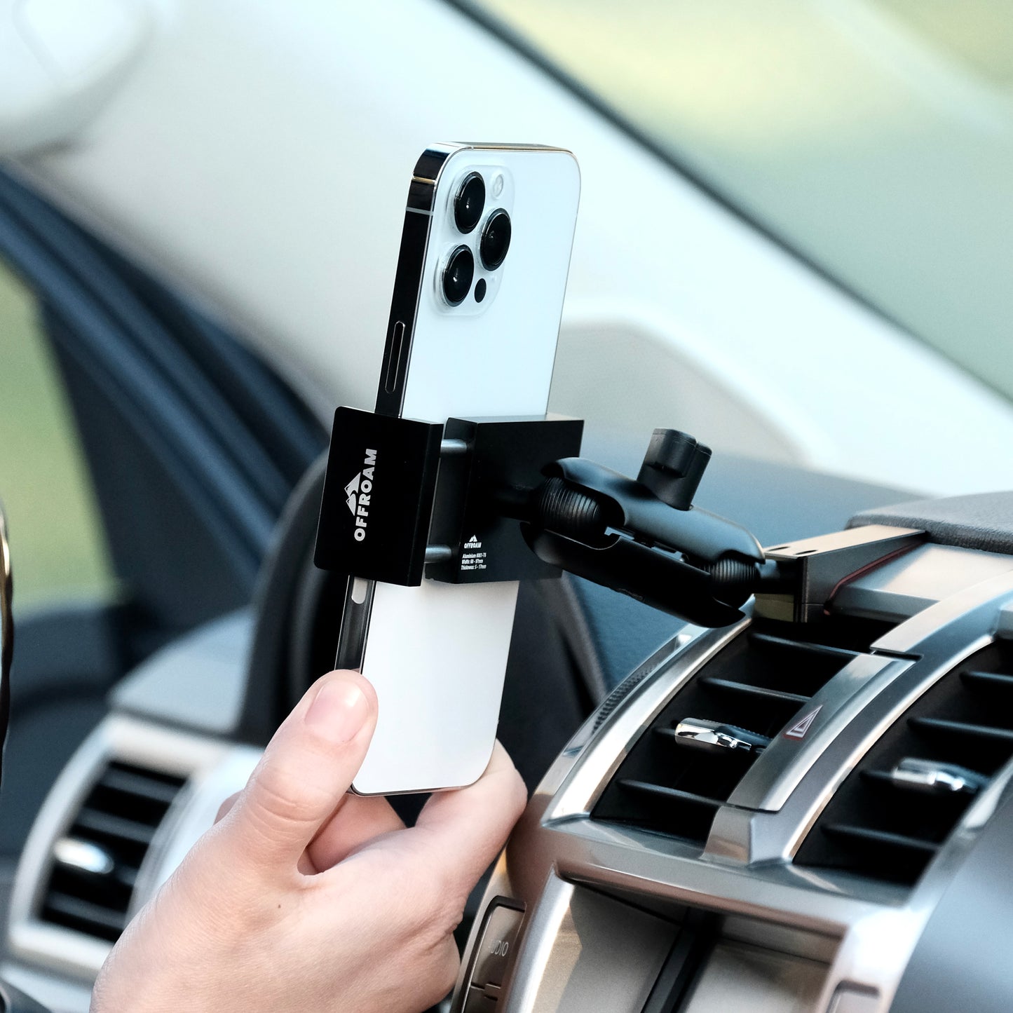 Image of Offroam Phone Mount installed securely in Lexus GX460 2010-2021. This premium phone mount installs easily without drilling or glue. Spring loaded Universal holder for use with any phone. Perfect placement without blocking screens, driver view, or air flow. Fully adjustable positioning.
