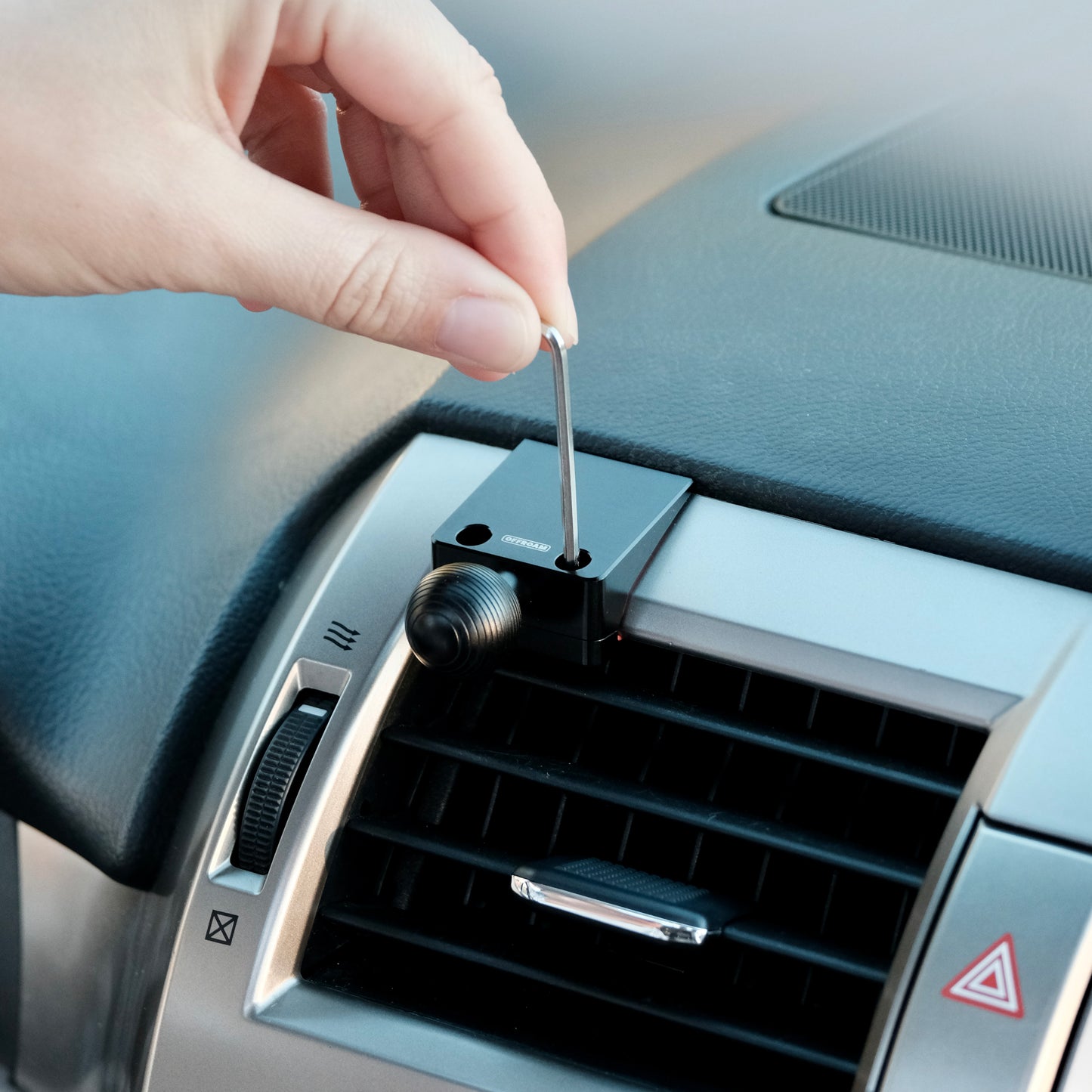 Image of Offroam Mounting Base installed securely in Lexus GX460 2010-2021. This premium all metal phone mounting base installs easily without drilling or glue. Perfect placement without blocking screens, driver view, or air flow.