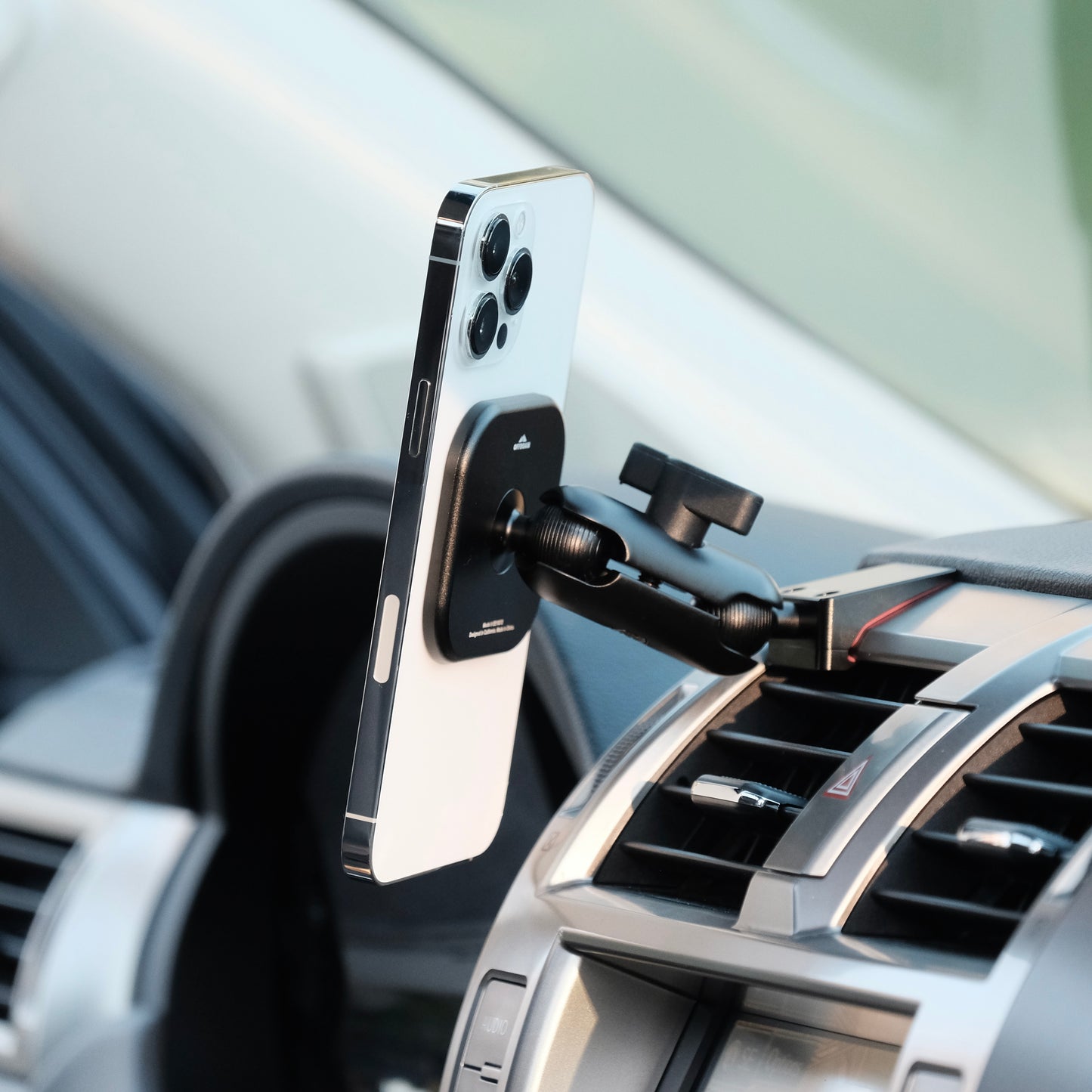 Image of Offroam MagSafe-compatible Phone Mount installed securely in Lexus GX460 2010-2021. This premium phone mount installs easily without drilling or glue. High force magnets hold phone on any trail, road, or track. Perfect placement without blocking screens, driver view, or air flow. Fully adjustable positioning.