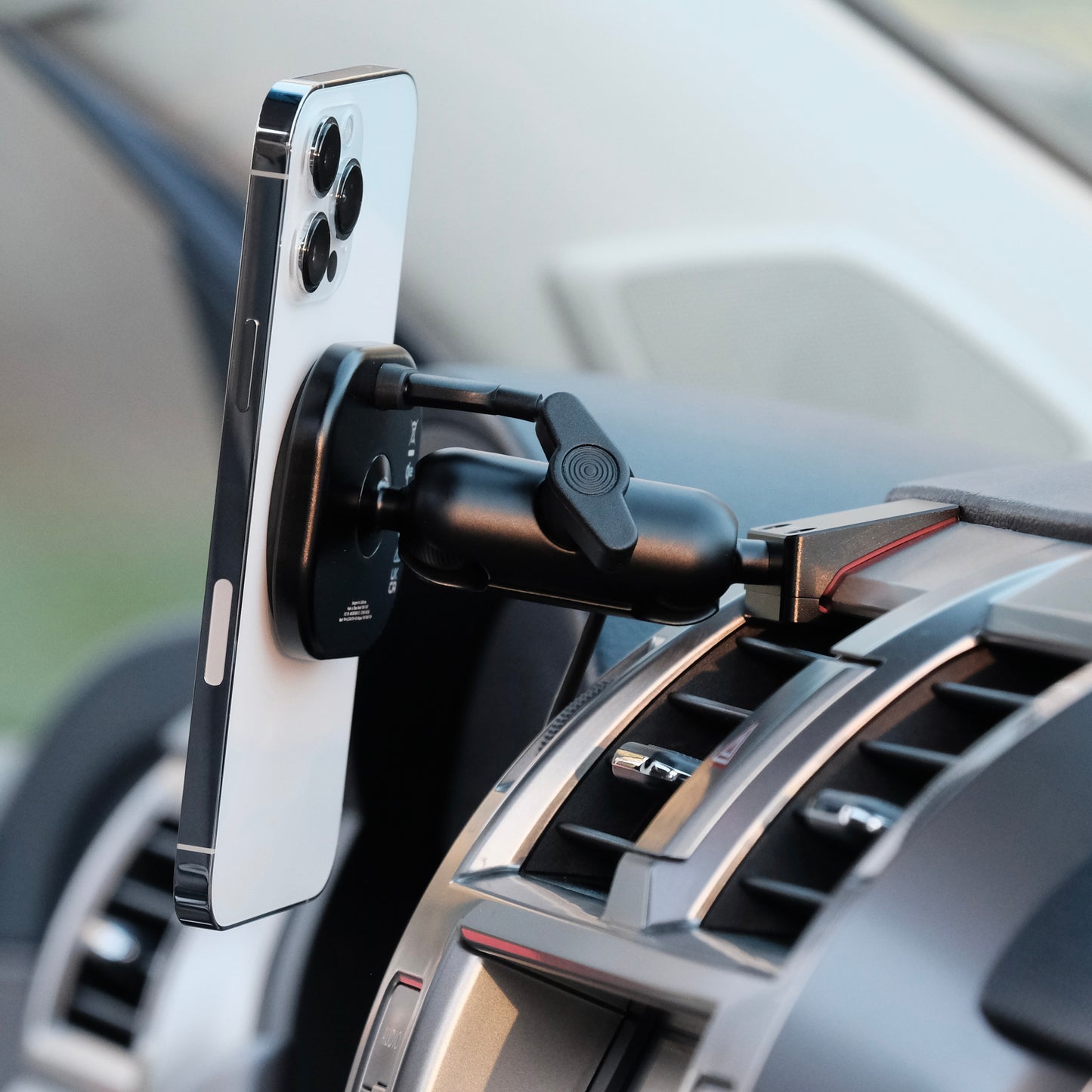 Offroam phone mount MagSafe Qi2 charging with phone attached securely with magnets shown installed in Lexus GX460 2011-2021 dashboard