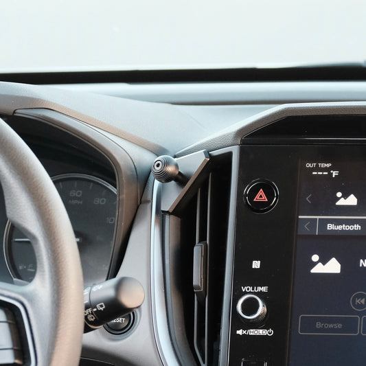 Image of Offroam Mounting Base installed securely in Subaru Crosstrek 2024-2026 | Impreza 2024-2026 | WRX 2022-2026. This premium all metal phone mounting base installs easily without drilling or glue. Perfect placement without blocking screens, driver view, or air flow.