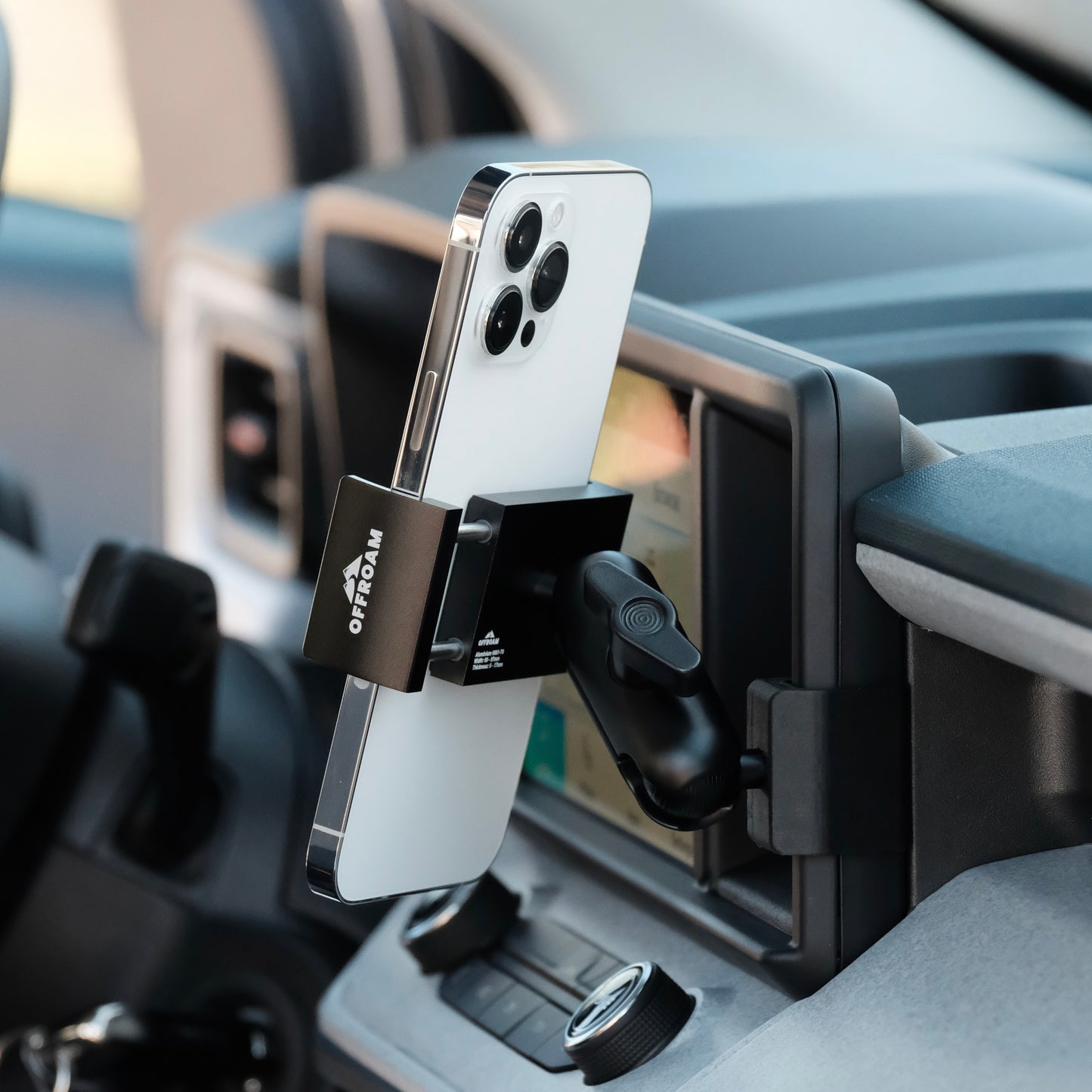 Image of Offroam Phone Mount installed securely in Ford Maverick 2022-2024. This premium phone mount installs easily without drilling or glue. Spring loaded Universal holder for use with any phone. Perfect placement without blocking screens, driver view, or air flow. Fully adjustable positioning.