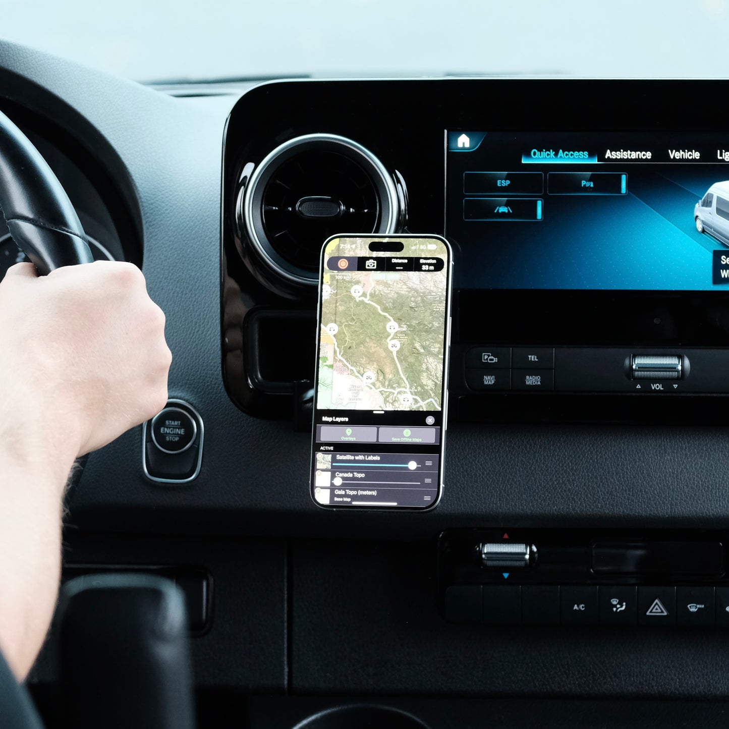 Image of Offroam MagSafe-compatible Phone Mount installed securely in Mercedes-Benz Sprinter 2019-2025. This premium phone mount installs easily without drilling or glue. High force magnets hold phone on any trail, road, or track. Perfect placement without blocking screens, driver view, or air flow. Fully adjustable positioning.