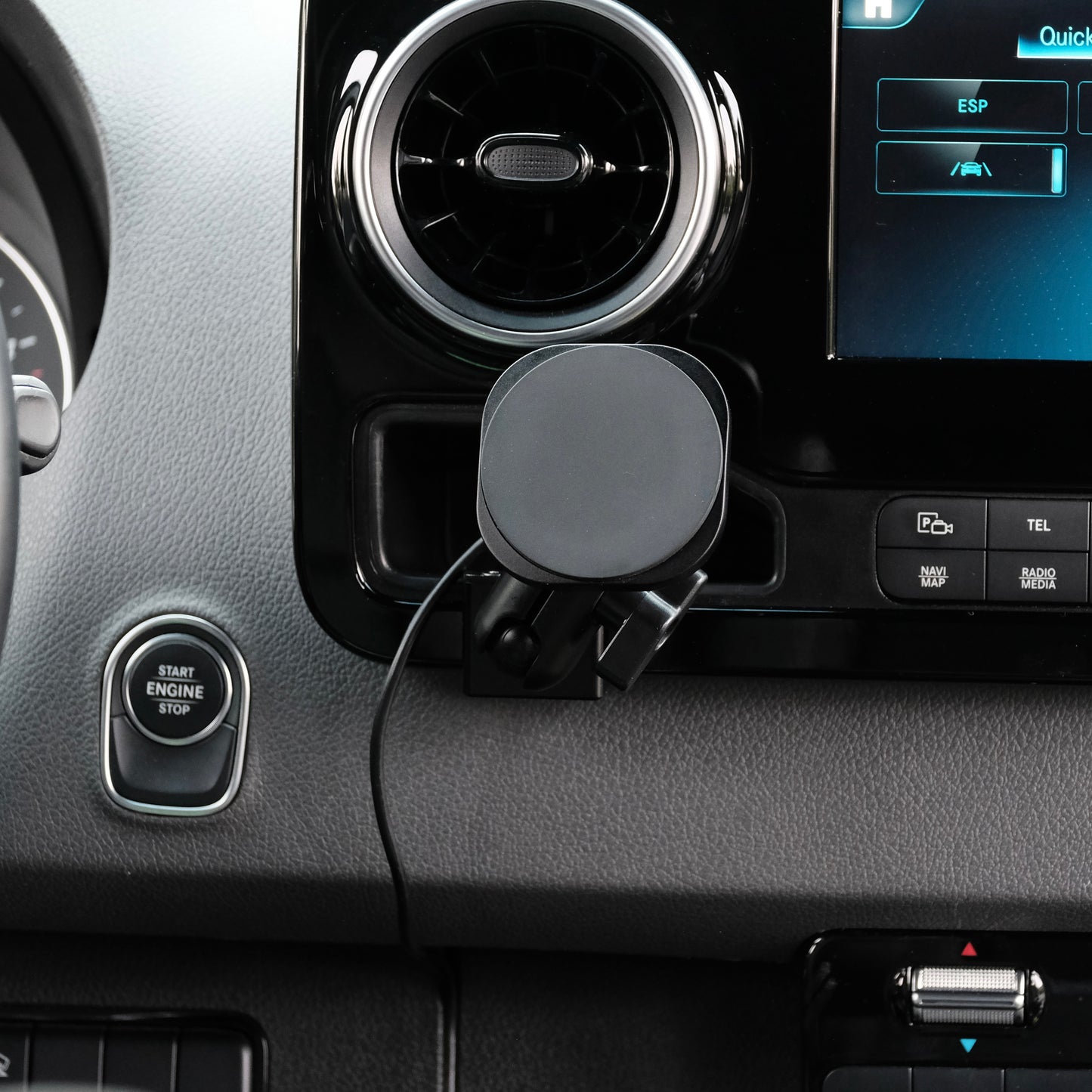 Image of Offroam MagSafe-compatible Phone Mount installed securely in Mercedes-Benz Sprinter 2019-2025. This premium phone mount installs easily without drilling or glue. High force magnets hold phone on any trail, road, or track. Perfect placement without blocking screens, driver view, or air flow. Fully adjustable positioning.