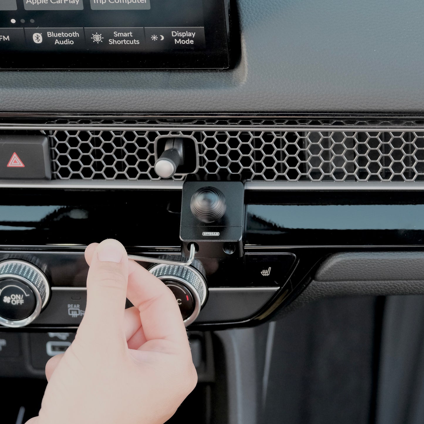 Image of Offroam Mounting Base installation for Honda Civic 2022-2026 | CR-V 2023-2026. This premium all metal phone mounting base installs easily without drilling or glue. Perfect placement without blocking screens, driver view, or air flow.