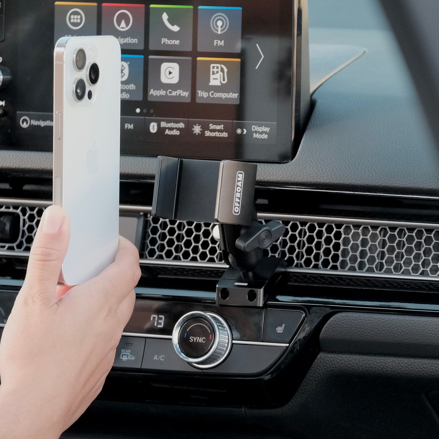 Image of Offroam Phone Mount installed securely in Honda Civic 2022-2026 | CR-V 2023-2026. This premium phone mount installs easily without drilling or glue. Spring loaded Universal holder for use with any phone. Perfect placement without blocking screens, driver view, or air flow. Fully adjustable positioning.