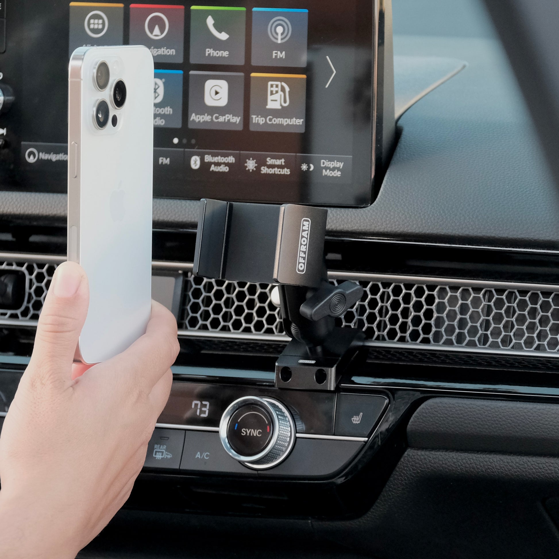 Image of Offroam Phone Mount installed securely in Honda Civic 2022-2026 | CR-V 2023-2026. This premium phone mount installs easily without drilling or glue. Spring loaded Universal holder for use with any phone. Perfect placement without blocking screens, driver view, or air flow. Fully adjustable positioning.