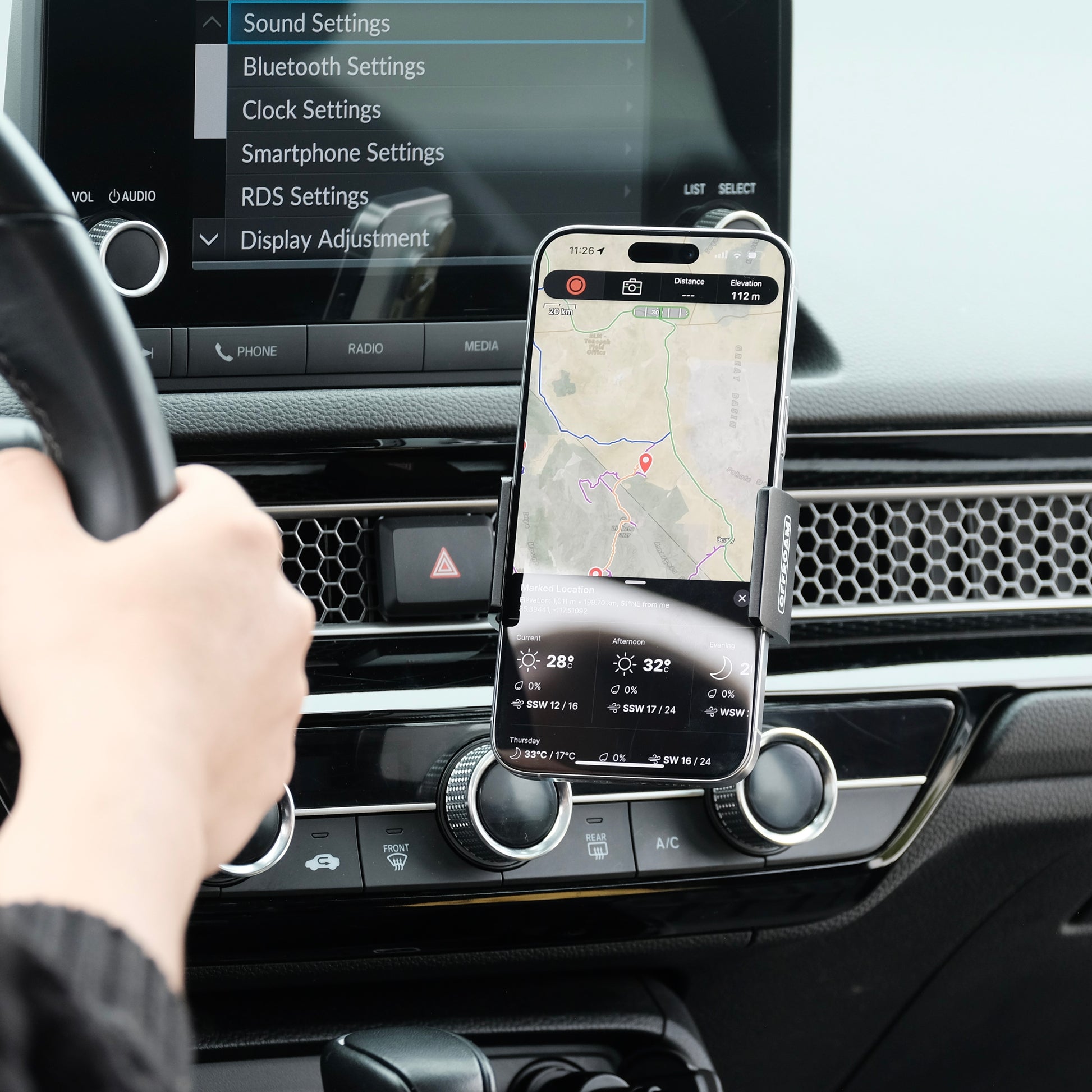 Image of Offroam Phone Mount installed securely in Honda Civic 2022-2026 | CR-V 2023-2026. This premium phone mount installs easily without drilling or glue. Spring loaded Universal holder for use with any phone. Perfect placement without blocking screens, driver view, or air flow. Fully adjustable positioning.