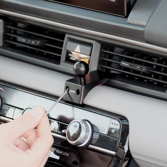Image of Offroam Mounting Base installed securely in Honda Pilot 2023-2025 | Passport 2026. This premium all metal phone mounting base installs easily without drilling or glue. Perfect placement without blocking screens, driver view, or air flow.