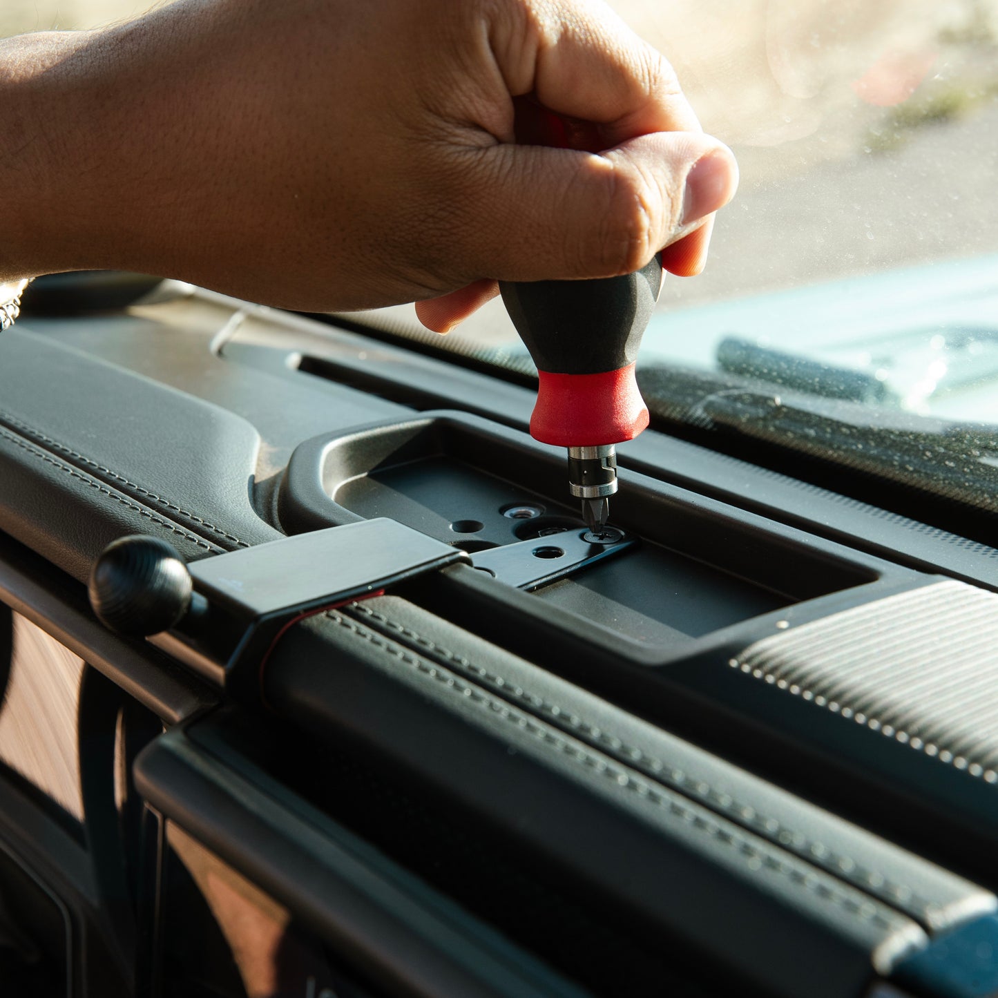 Image of Offroam Phone Mount installation in Jeep Wrangler | Gladiator 2024-2025. This premium phone mount installs easily without drilling or glue. Spring loaded Universal holder for use with any phone. Perfect placement without blocking screens, driver view, or air flow. Fully adjustable positioning.