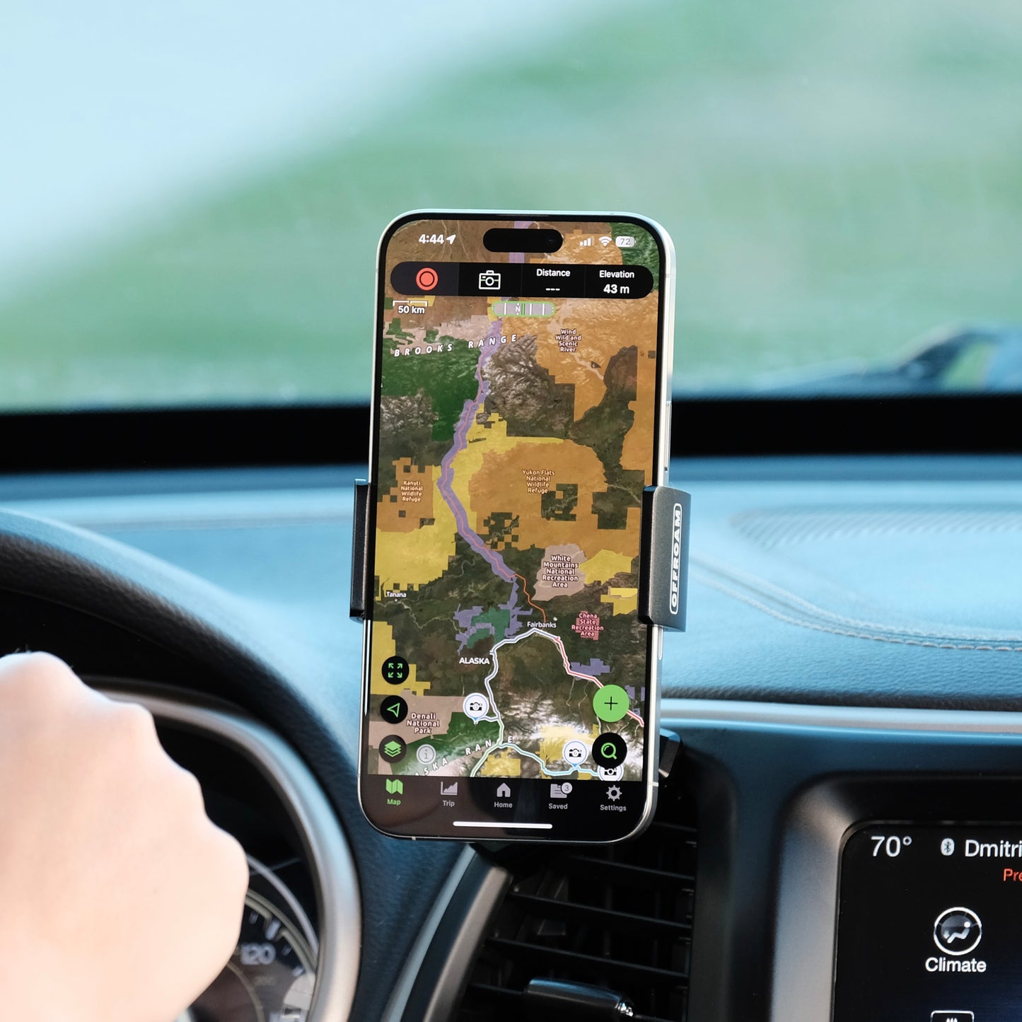Jeep Cherokee 2014 to 2018 shown with Offroam full mount installed in a perfect spot that does not block the airflow or controls or the field of view shown with a person hand in the steering wheel for scale and perfect placement