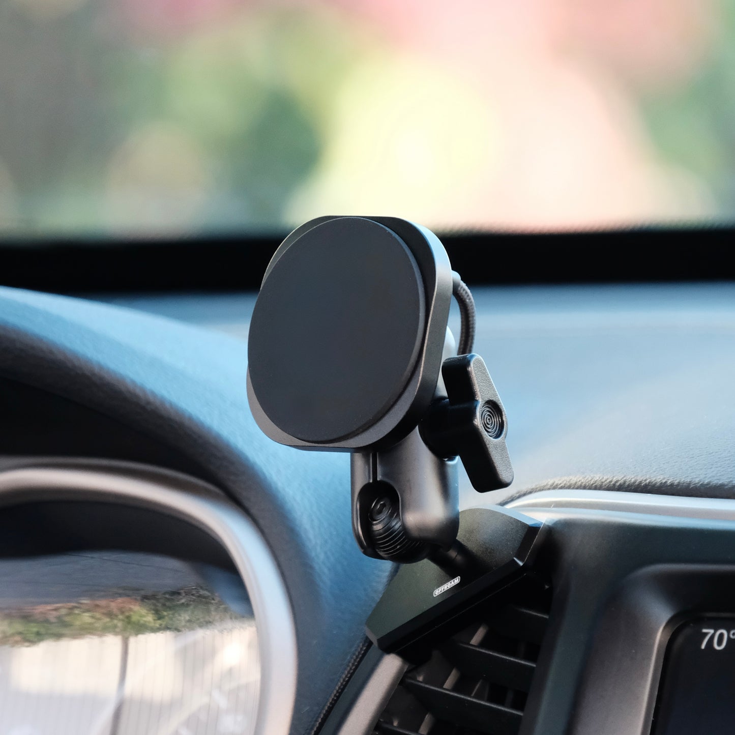 Offroam phone mount installed securely to the dashboard of Jeep Cherokee 2014–2018 shown with Qi2 charging MagSafe compatible phone mount attached to it.