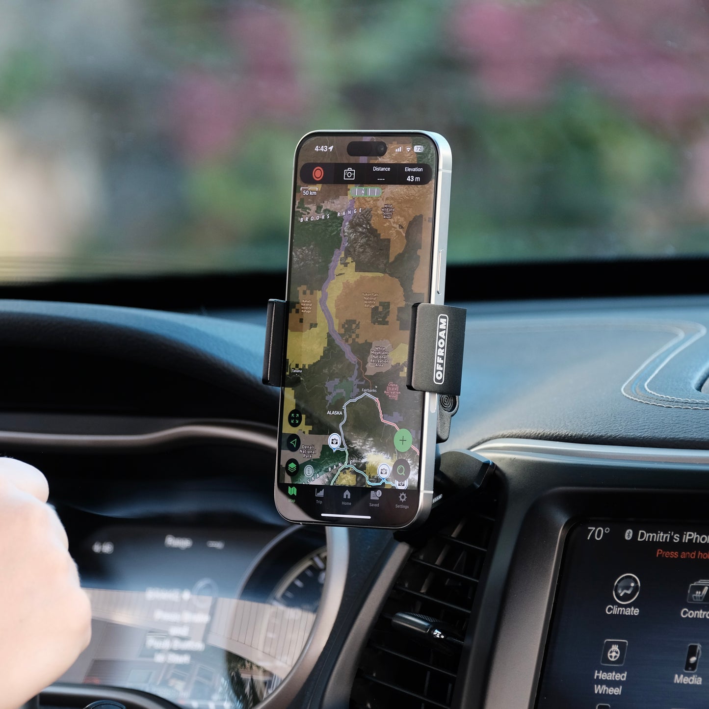 Offroam phone mount installed in a jeep Cherokee 2014-2018 shown from a side angle that demonstrates OEM like clean, install secure hold, and how beautifully it blends to the dashboard while securely, holding your phone in a perfect place without blocking the airflow