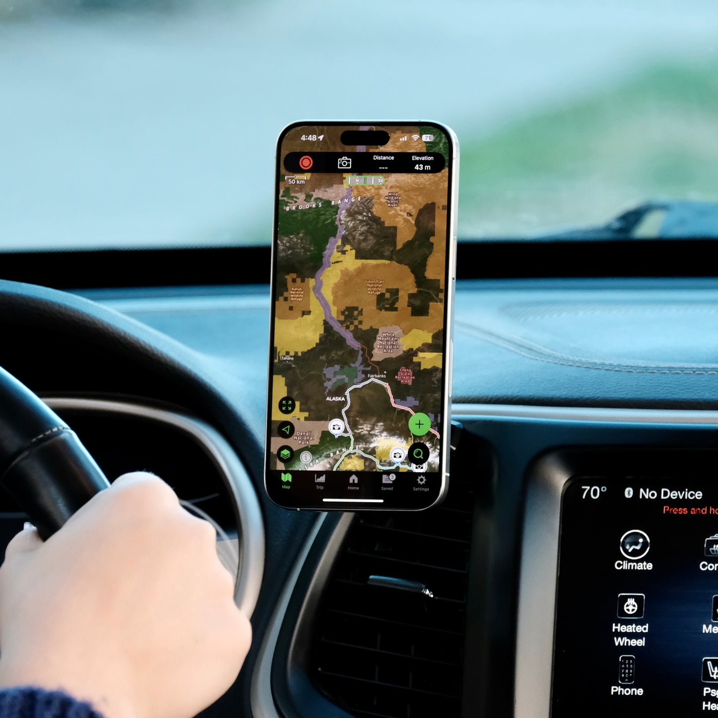 Offroam phone holder in a Jeep Cherokee 20 14-2018 shown placed in a perfect position without blocking the airflow or the field of view