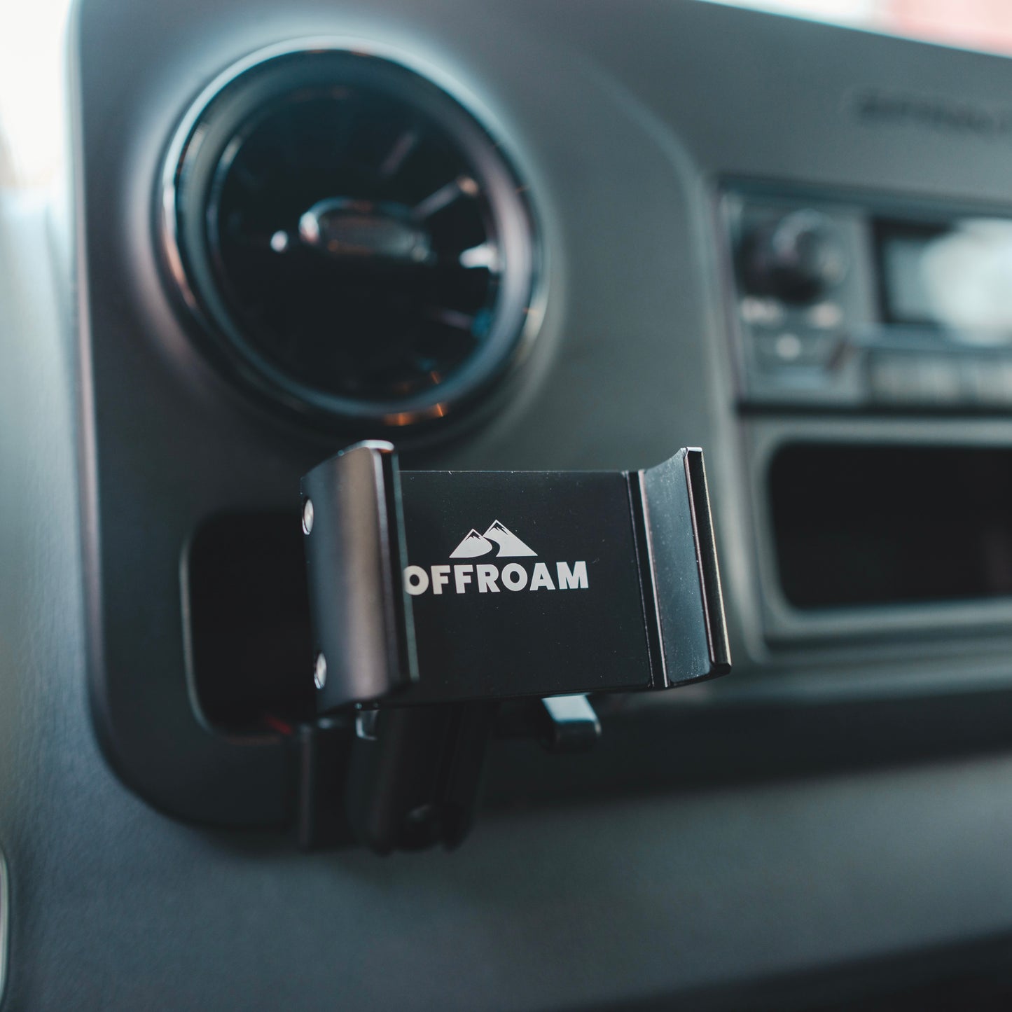 Image of Offroam Phone Mount for Mercedes-Benz Sprinter 2019-2025. This premium all metal phone mounting base installs easily without drilling or glue. Perfect placement without blocking screens, driver view, or air flow.