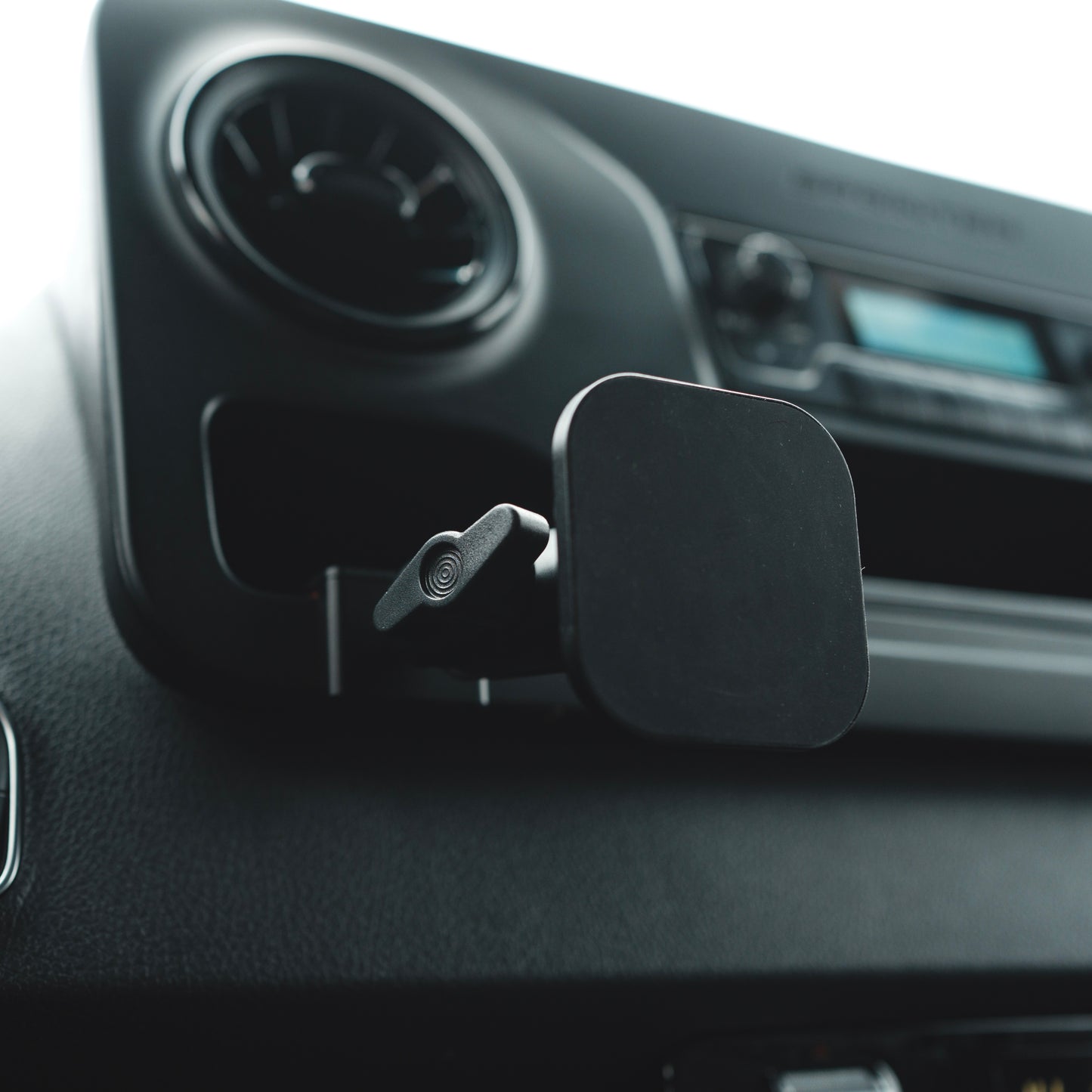 Image of Offroam MagSafe-compatible Phone Mount installed securely in Mercedes-Benz Sprinter 2019-2025. This premium phone mount installs easily without drilling or glue. High force magnets hold phone on any trail, road, or track. Perfect placement without blocking screens, driver view, or air flow. Fully adjustable positioning.