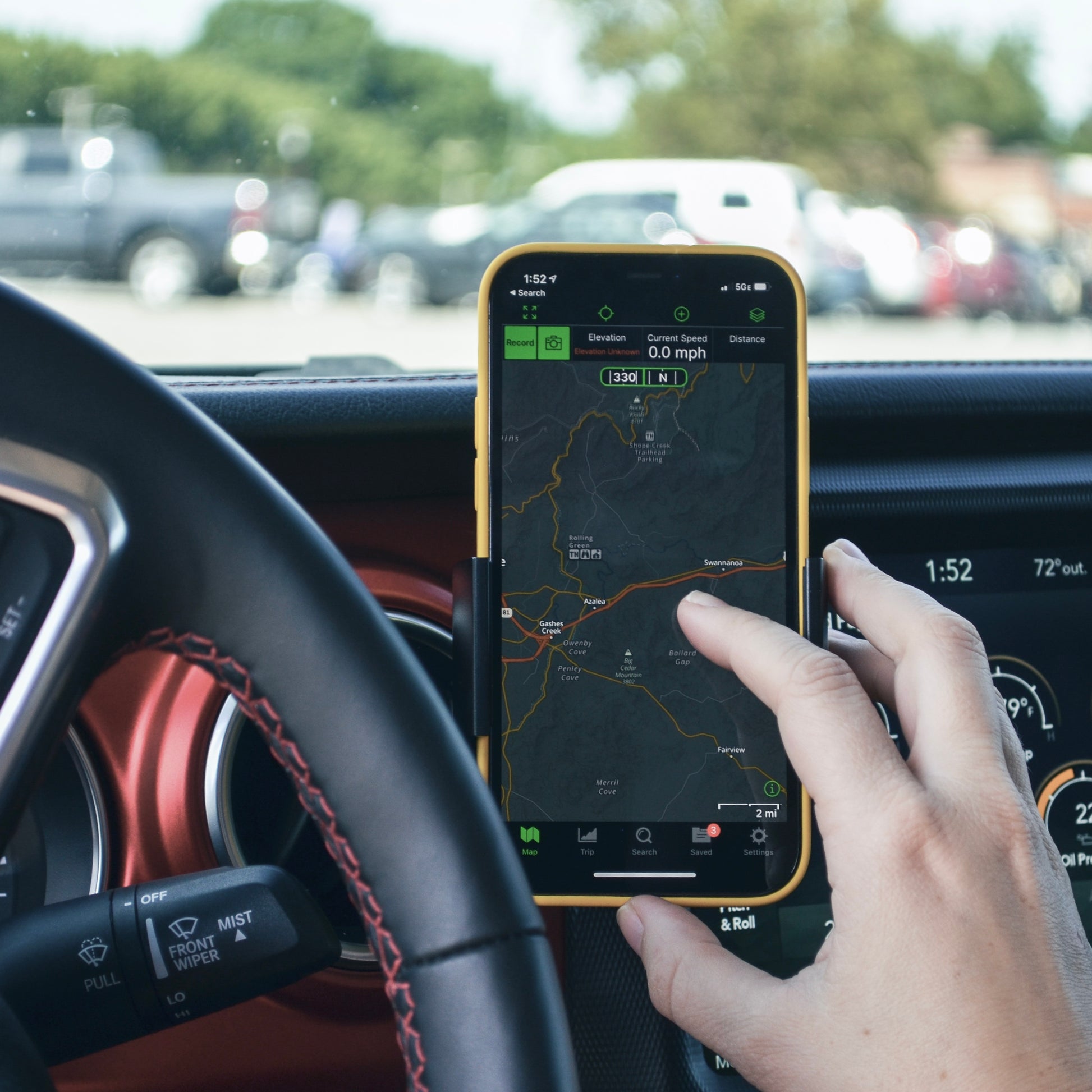 Image of Offroam Phone Mount installed securely in Jeep Wrangler 2018-2023 | Gladiator 2019-2023. This premium phone mount installs easily without drilling or glue. Spring loaded Universal holder for use with any phone. Perfect placement without blocking screens, driver view, or air flow. Fully adjustable positioning.