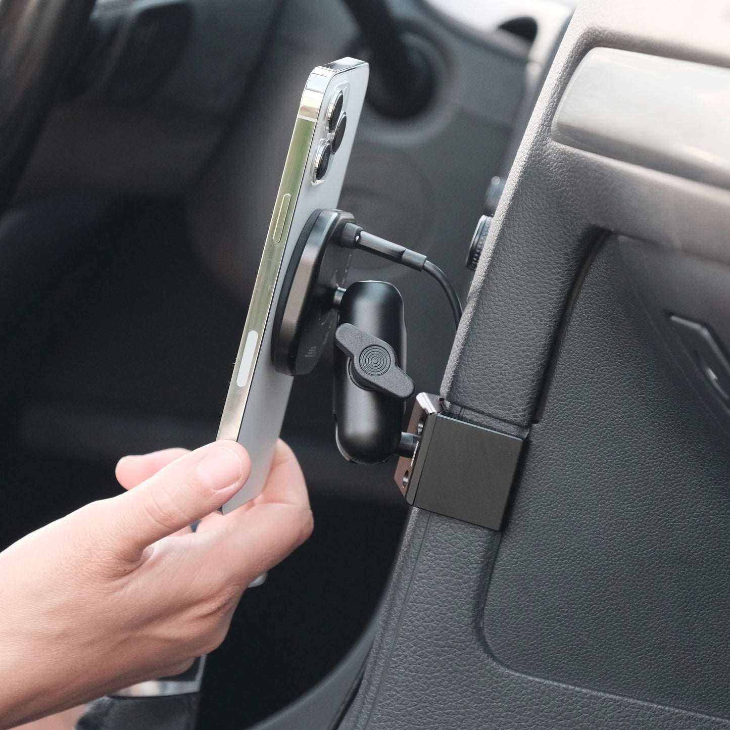 Volkswagen Golf 2015–2021 phone mount with MagSafe-compatible Qi2 wireless charging securely holding iPhone on the dash, angled for clear visibility.